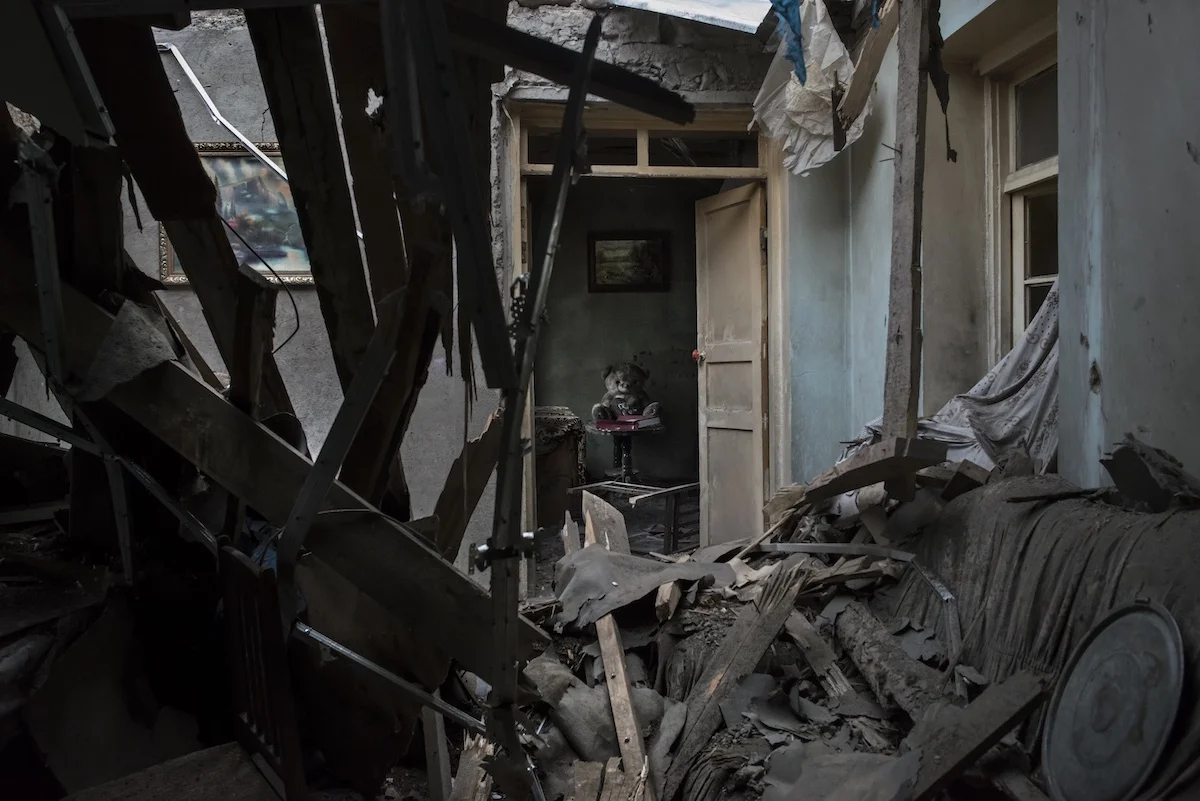 With furniture and toys covered with dirt and dust, one of the destroyed houses in the Talish village belongs to the Sahakyan family. The parents with three children and their grandmother, escaped the house the night when shootings began in the direction of the village.