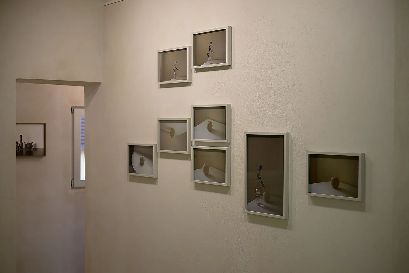 Table Studies , Installation View, Bologna MUSEI, Casa Morandi , 2016 Curated by Alessia Masi "Looking at his works of those years, one can see that David Adika already has a clear vision of his path. Starting from photography, he adds images which are absolutely devoid of any reference to other specific items. “ My photographs are a by-product of the reality of my life. They deal with my personal biography, the collective memory of the society in which I live, and they connect political reality to social reality. In my photographic work, I want to show the presence of beauty, and for this I use strategies of seduction and capture. I am looking for the photographic moment - a specific event of beauty realized in the mechanical photographic act that will fix it forever as a photograph” . Photography, then, as the search for beauty, as a medium able to express seduction and sensuality even through common objects like a plastic bottle or a melon, able to transform the ordinary into something extraordinary and special through the attempt to instill “beauty in everything” - as he says - and leaving it to the visitor to determine aesthetic value, or rather to consider the possibility that “aesthetics” is not just a matter of beauty, but also a function of the relationship between place, identity, image and gaze. Adika , like many other artists all over the world, gladly acknowledges that he finds inspiration in Morandi's work , as a synthesis of color, balance, sensibility and simplicity. So, the decision to exhibit some of Adika's works in the house on Via Fondazza is intended as a further confirmation of the extent to which Morandi's art continues to be a field of research and a source of inspiration for so many young artists. Indeed, it is obvious that the Israeli artist has also internalized the Morandian lesson according to a personal vision, achieved through a careful study of composition and a profound inquiry into the relationship between idea and reality. Subverting the Bressonian theory of the “decisive moment”, as the great French photographer defines the unexpected instant that is worthy of being immortalized, Adika uses the photographic medium to overcome any time-related contingency and to articulate “mental and social questions”. What makes his work really extraordinary is light, a very pure and original light, which almost seems to reject shadow. Although it departs from the pictorial nature of Morandi's light, it evokes it, succeeding in “writing” (from photos graphia = writing with light) images whose similarity is no more than apparent, in perfect harmony with Morandi's variants. “I let myself be totally guided by the light, and I am always in motion, along a path that is a continuous effort to subdue the light”. In Table Studies the minor changes and the subtle variations of light and composition are preparatory to the construction of sense and significance. Seen in sequence, the works seem like frames of a film that restore to each individual subject its own particular significance and expressive value. They look like fragments of an action in motion, where the sometimes imperceptible movement of the subject, or at other times its disappearance, recreates a balanced framing, with an orchestral rhythm and a strong geometrical tension. “If I were to have another life, I would work in the cinema,” the Bolognese artist once said, according to the oral testimony of Carlo Zucchini, sponsor of the Morandi donation. A phrase that most probably alludes precisely to the possibility of seeing his works as a succession of frames, of images that appear in succession, only to be connected in a single large-scale scene, just as happens in film. Likewise in the case of Adika, where the artist playfully overturns the image, we should read his unceasing efforts to undermine the existing order as suggesting new relationships between identity, gaze and sign, beyond prearranged classifications and divisions.