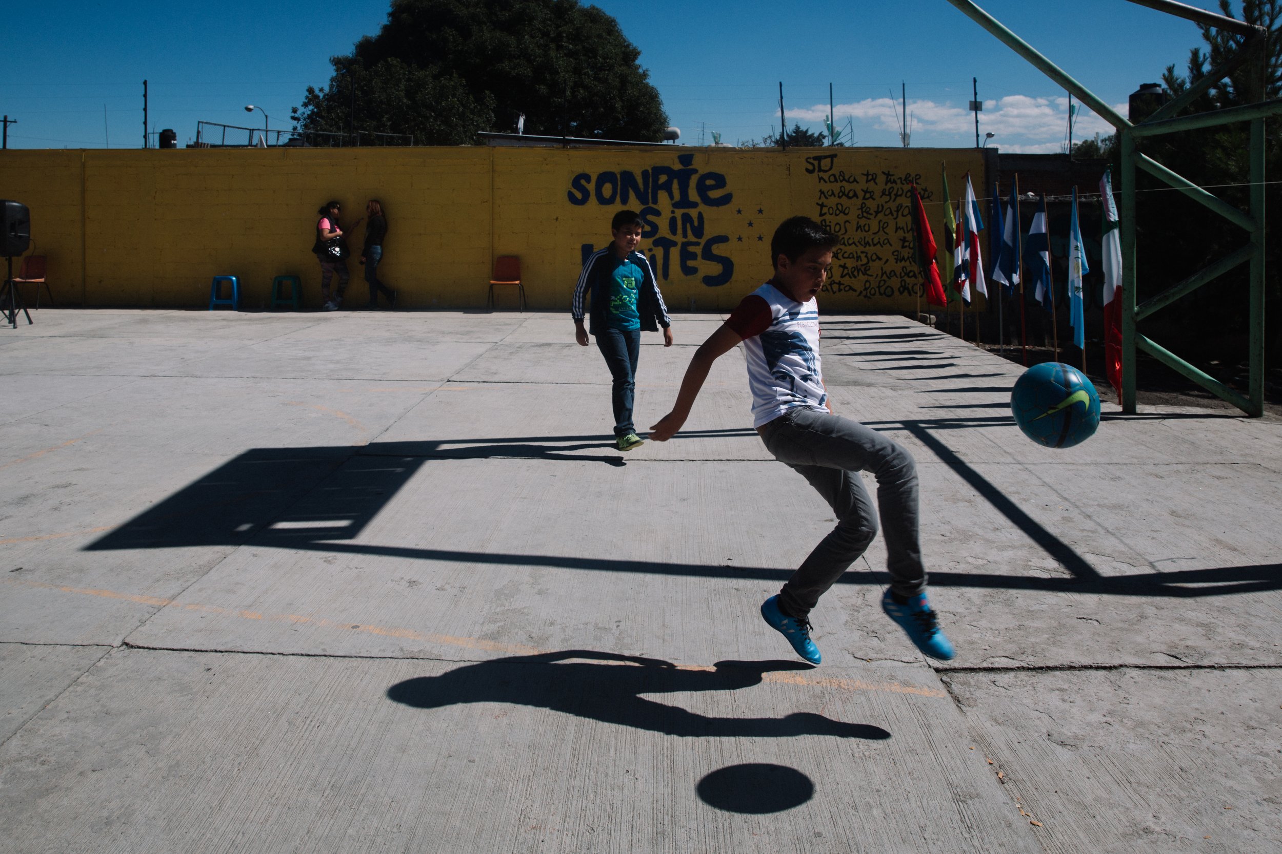  In the midst of the challenging and uncertain life of migration, children find solace and joy by playing soccer in the courtyard of the Albergue La Sagrada Familia migrant shelter in Apizaco, Tlaxcala, Mexico. 