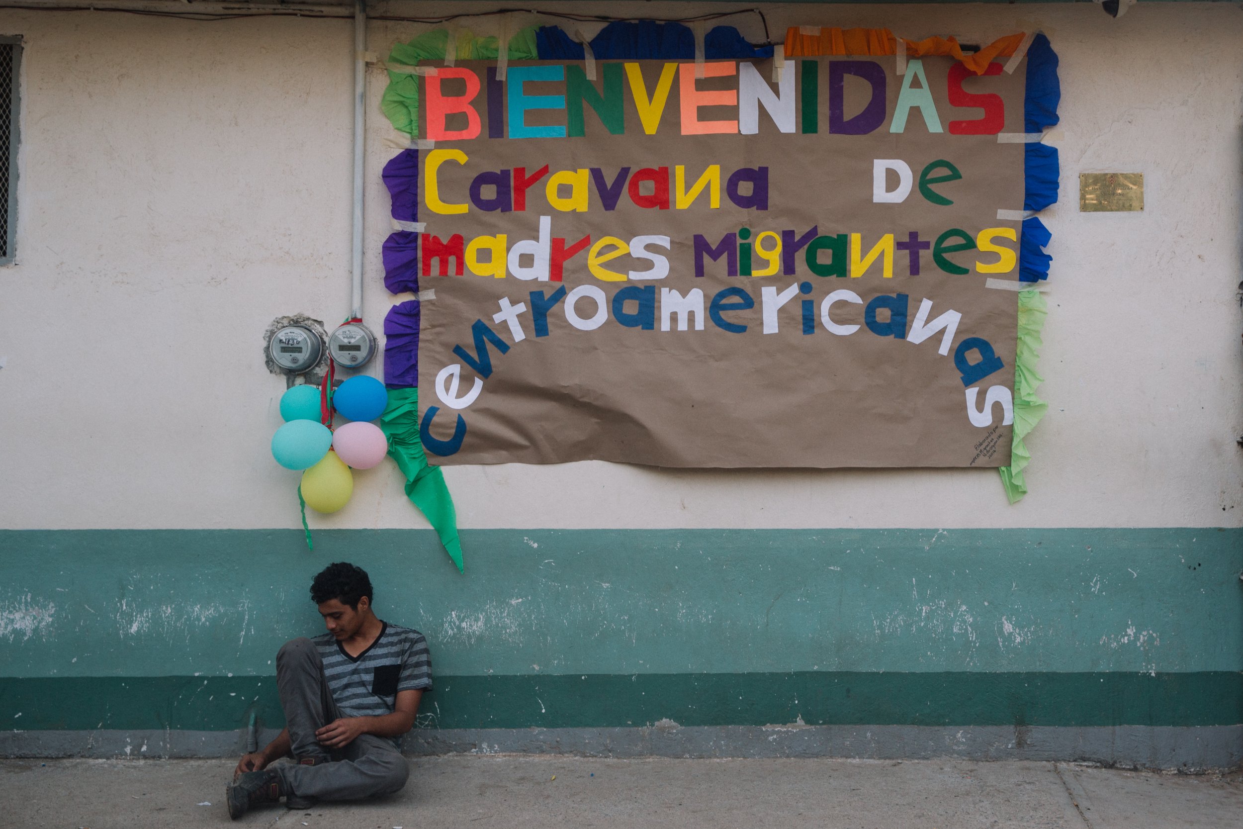  A welcome sign hangs outside of the "Hermanos en el Camino" migrant shelter, where the caravan of mothers will stop and stay the night in Ixtepec, Oaxaca, Mexico. 