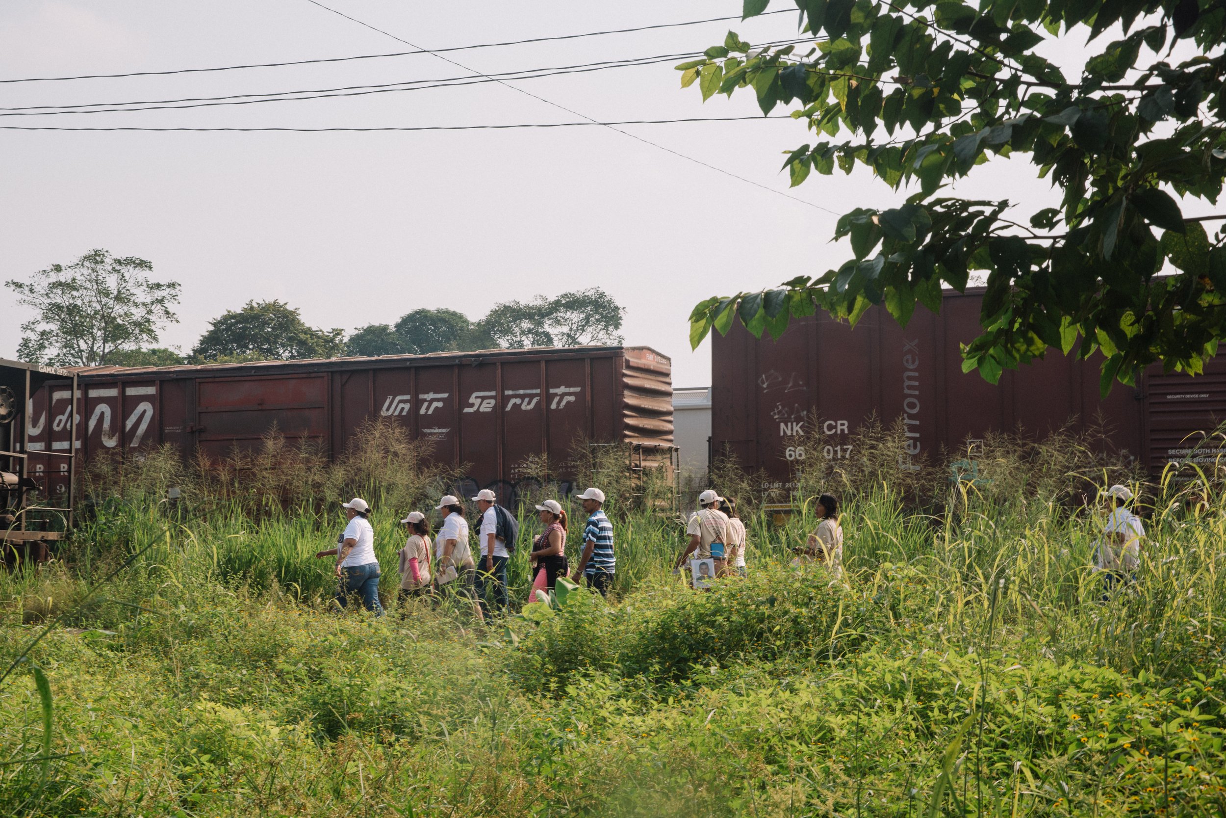  As the mothers journey through Mexico in search of their missing loved ones, the caravan of mothers splits into smaller groups to speak with people in neighborhoods along the train tracks that frequently carry migrants through the country in Villa E