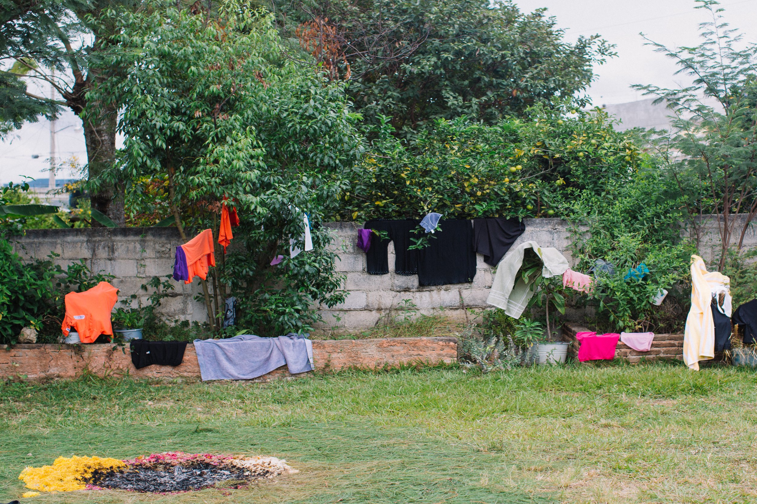  The mothers of the caravan wash and hang their clothes to dry during a rest stop on their journey. With limited space and resources, they must travel light. 