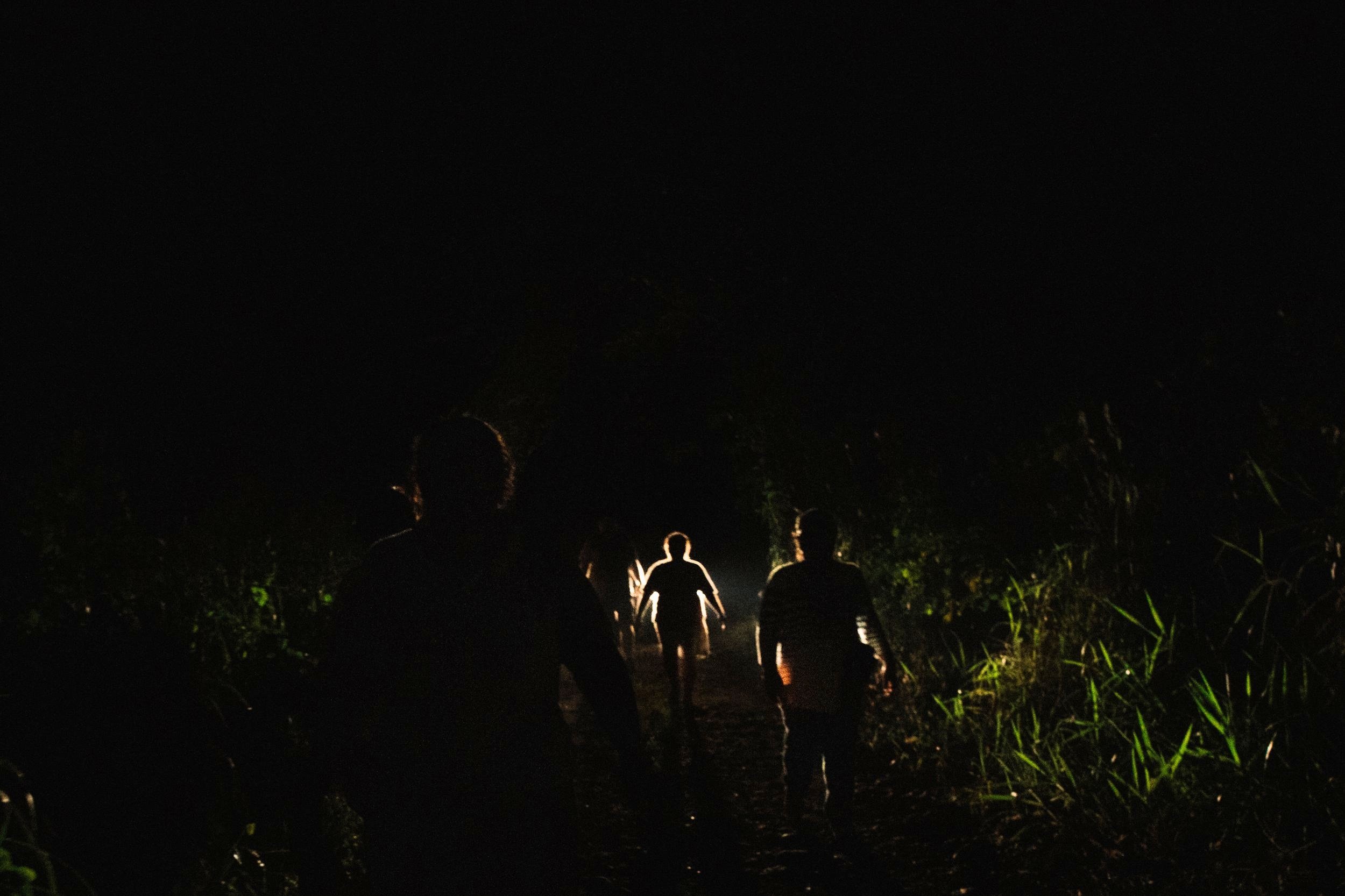  Deep into the night, the exhausted and determined mothers walk back from their final remote stop, having spent a long day searching for their missing loved ones, to rejoin the caravan in Tapachula, Chiapas, Mexico. 