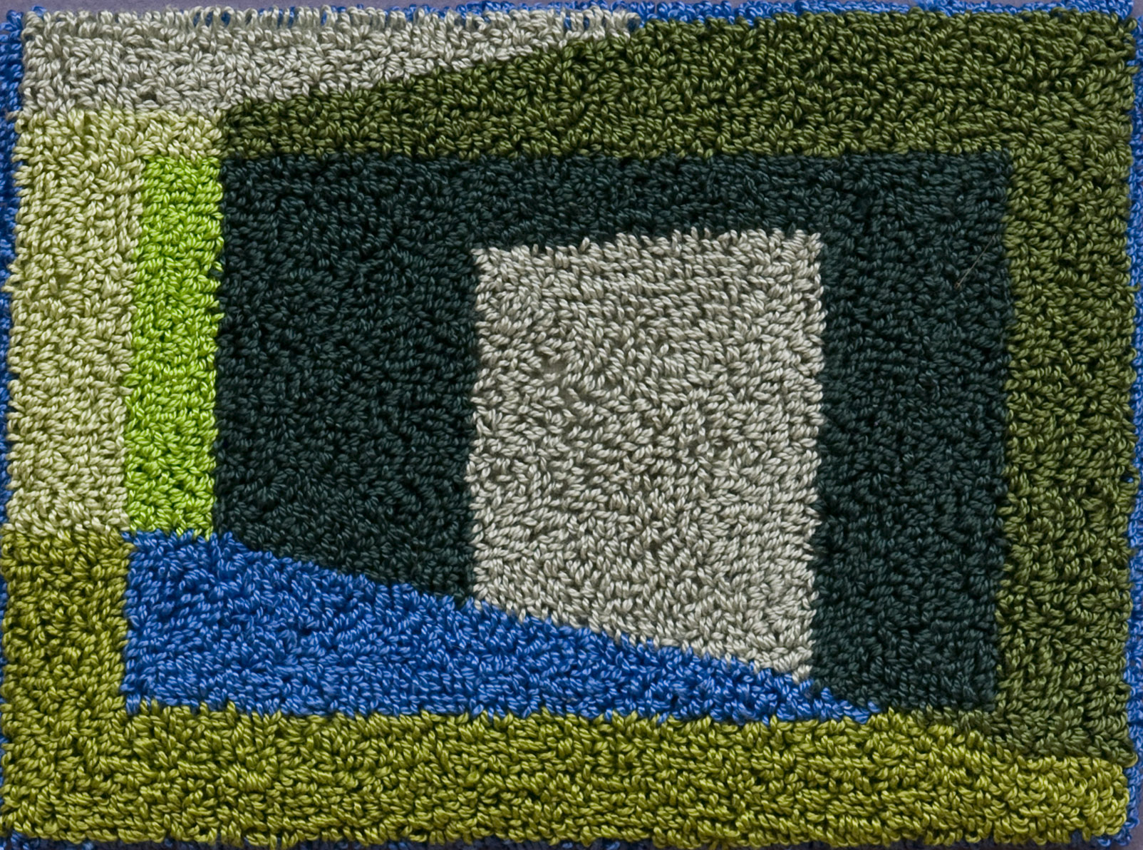 400-5. The Geometer's Hand 11, 4"x6", hand needlepunched on monks cloth, framed 8"x10"