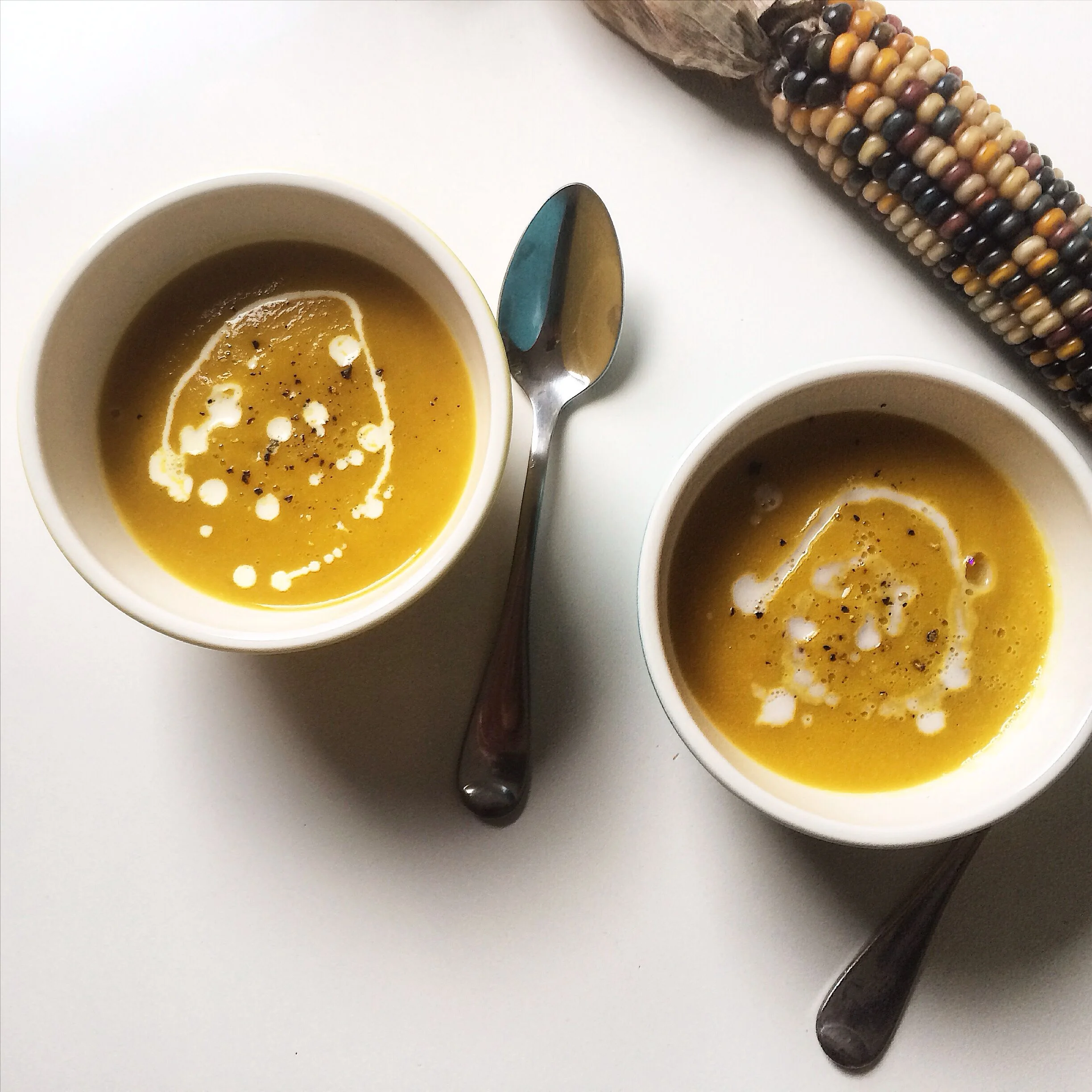 Curried apple Melonette soup finished with cream (left) and coconut milk (right).