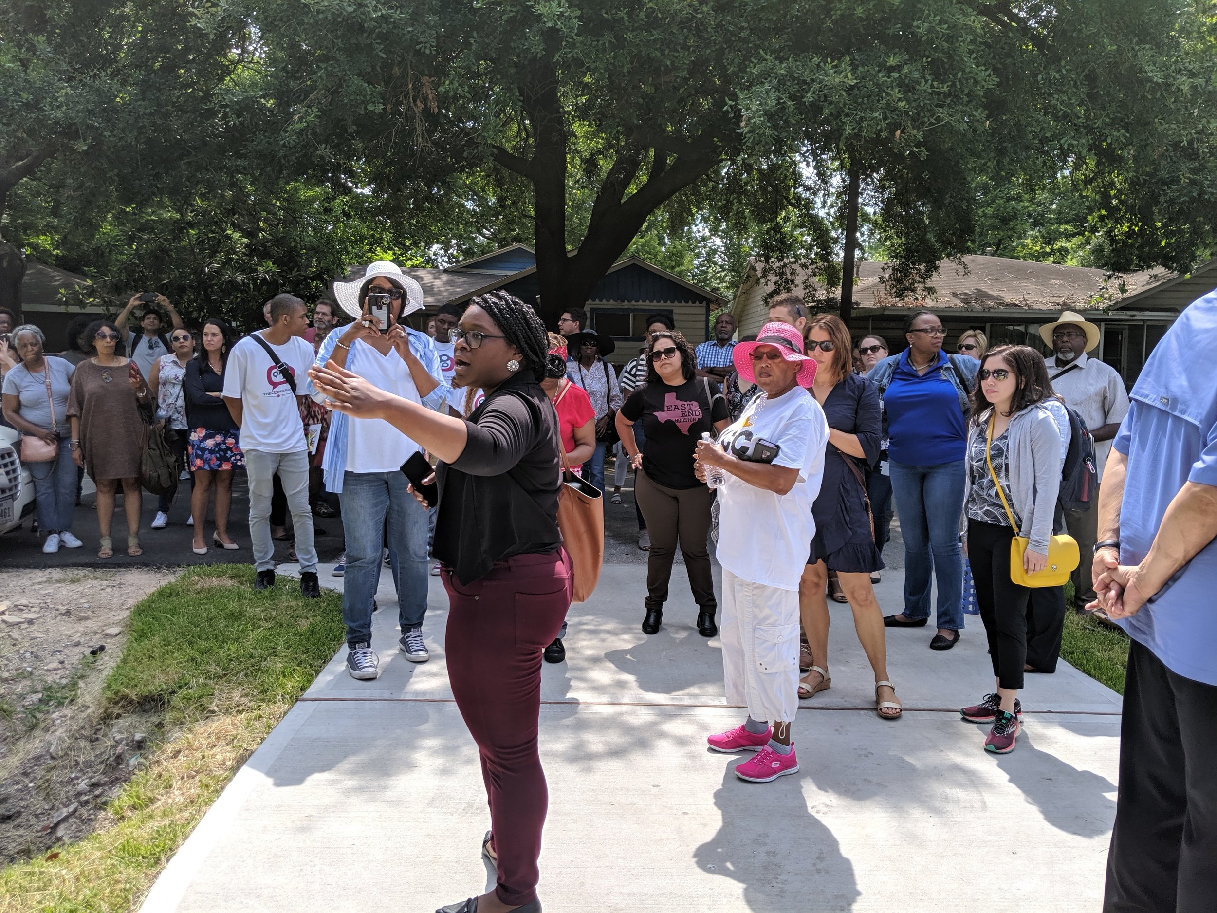 Executive Director of the Houston Community Land Trust, Ashley Allen, showcasing the initial homes built for the Houston Community Land Trust