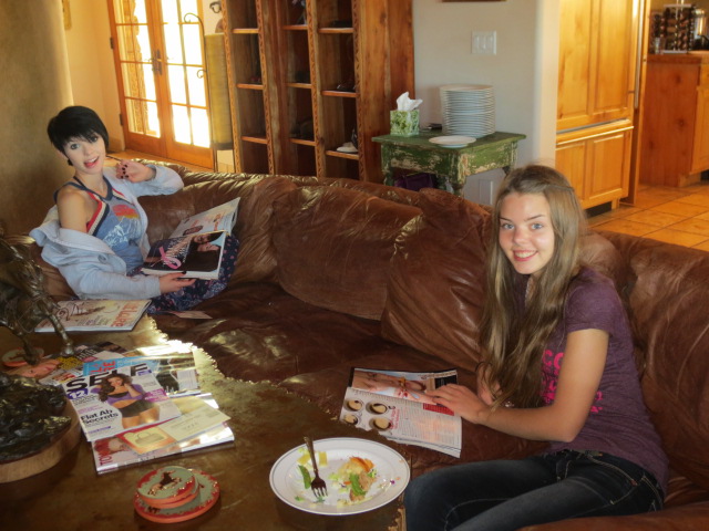 Sophia and Dora enjoying lunch and some glossy magazine time.
