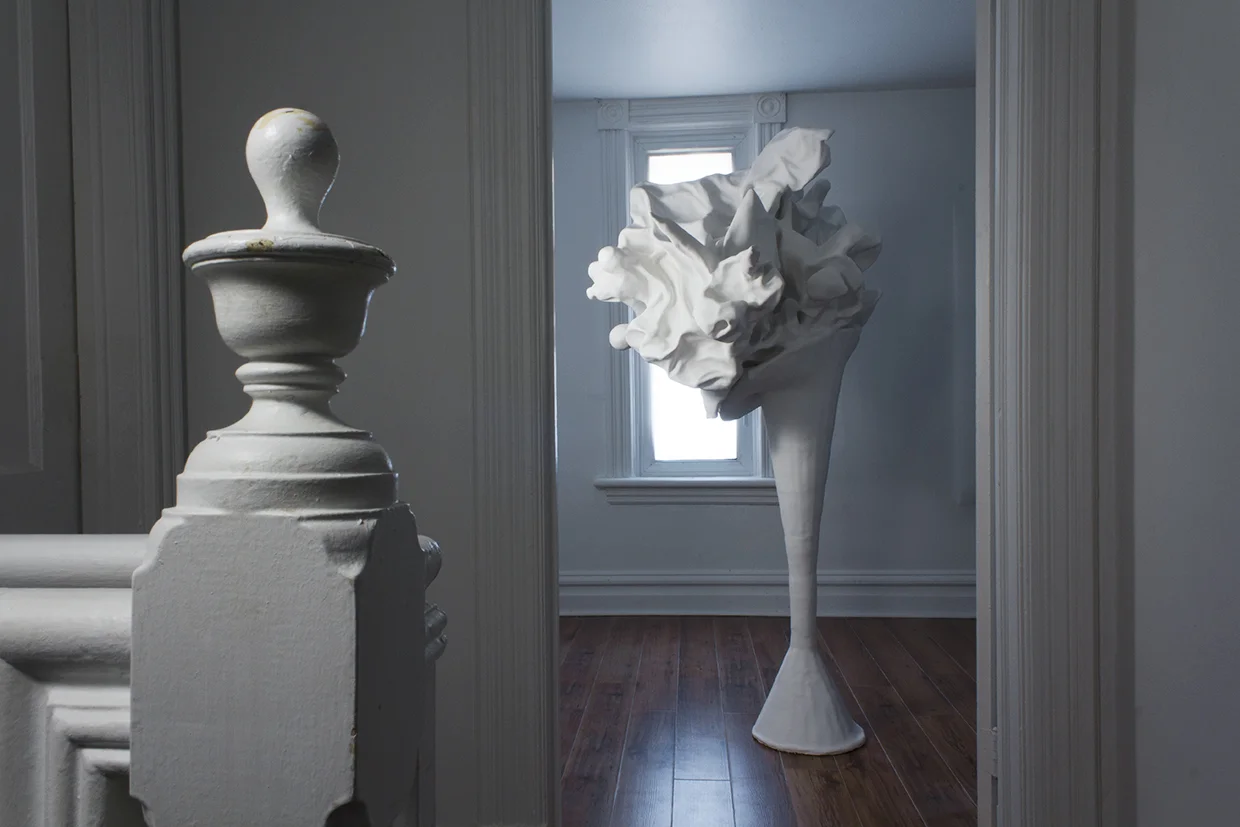 Untitled (from the series Sculpture & Photography), 2015, plaster, fake flowers, cement, 45 in x 65 in.