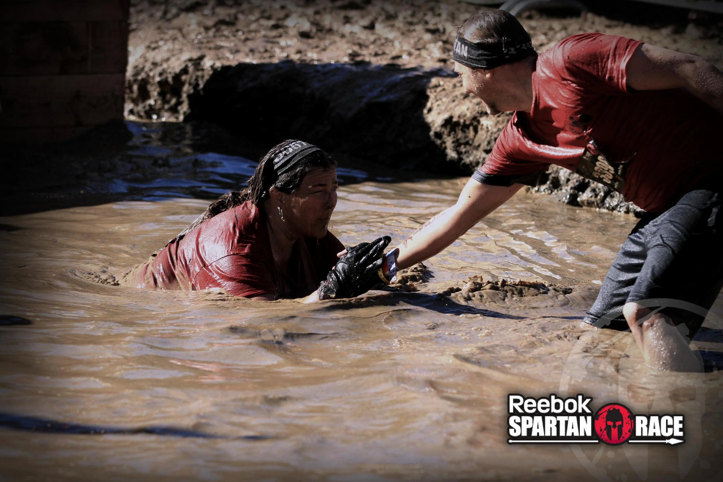 Daniel helps me out of the muddy water as I struggle to see through the mud caking my eyes shut.
