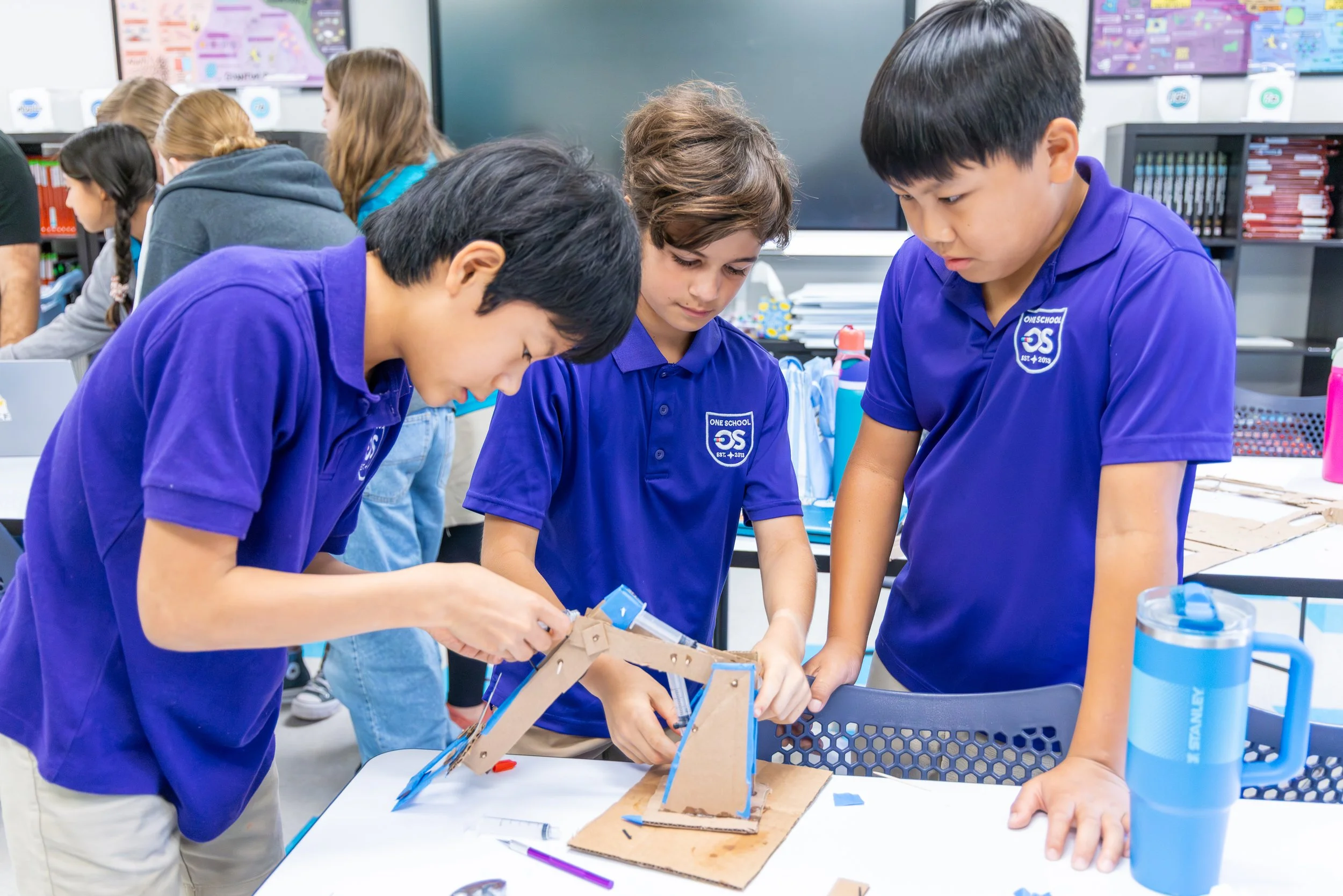 Twice-exceptional middle schoolers collaborating on a hands-on project in a neurodivergent-friendly classroom