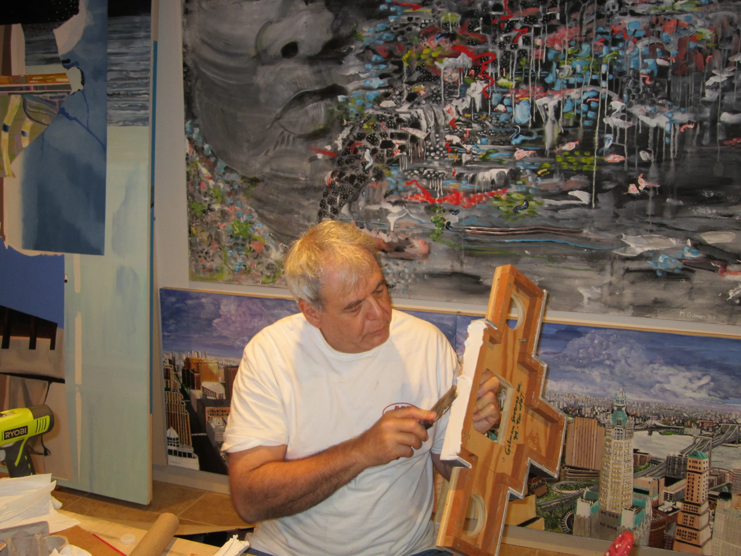 Applying mastic to the mahogany edging for the stone base