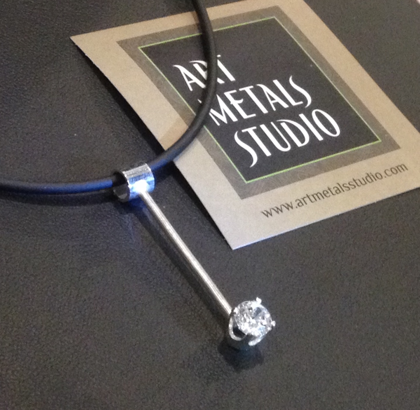 Sterling Silver and CZ pendant by Art Metals Studio. Customers that guess correctly in "Know Your Bling" will be entered into a drawing to win this pendant. Good luck!!!