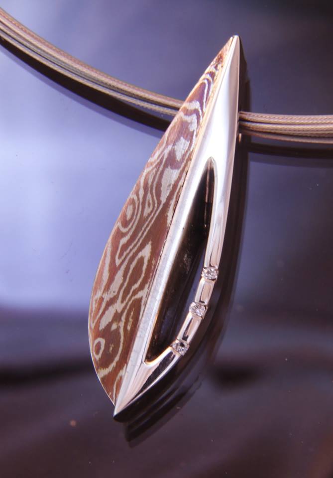 2016 Limited Edition Pendant by Christopher Sklba and Art Metals Studio. The pendant pictured (#1/20) is a Sterling Silver cast piece with Sterling and Copper Mokume Gane and Diamond accents. Each pendant is unique and stamped with its series number. Contact us for details.