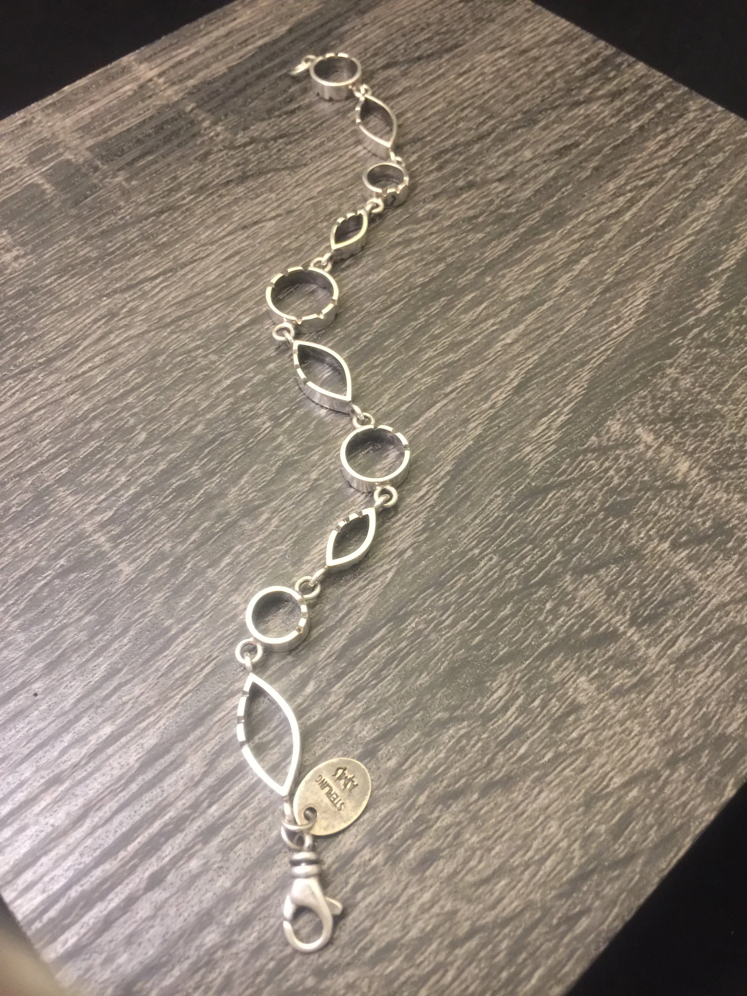 link AMS bracelet sterling circle marquise with notches.JPG