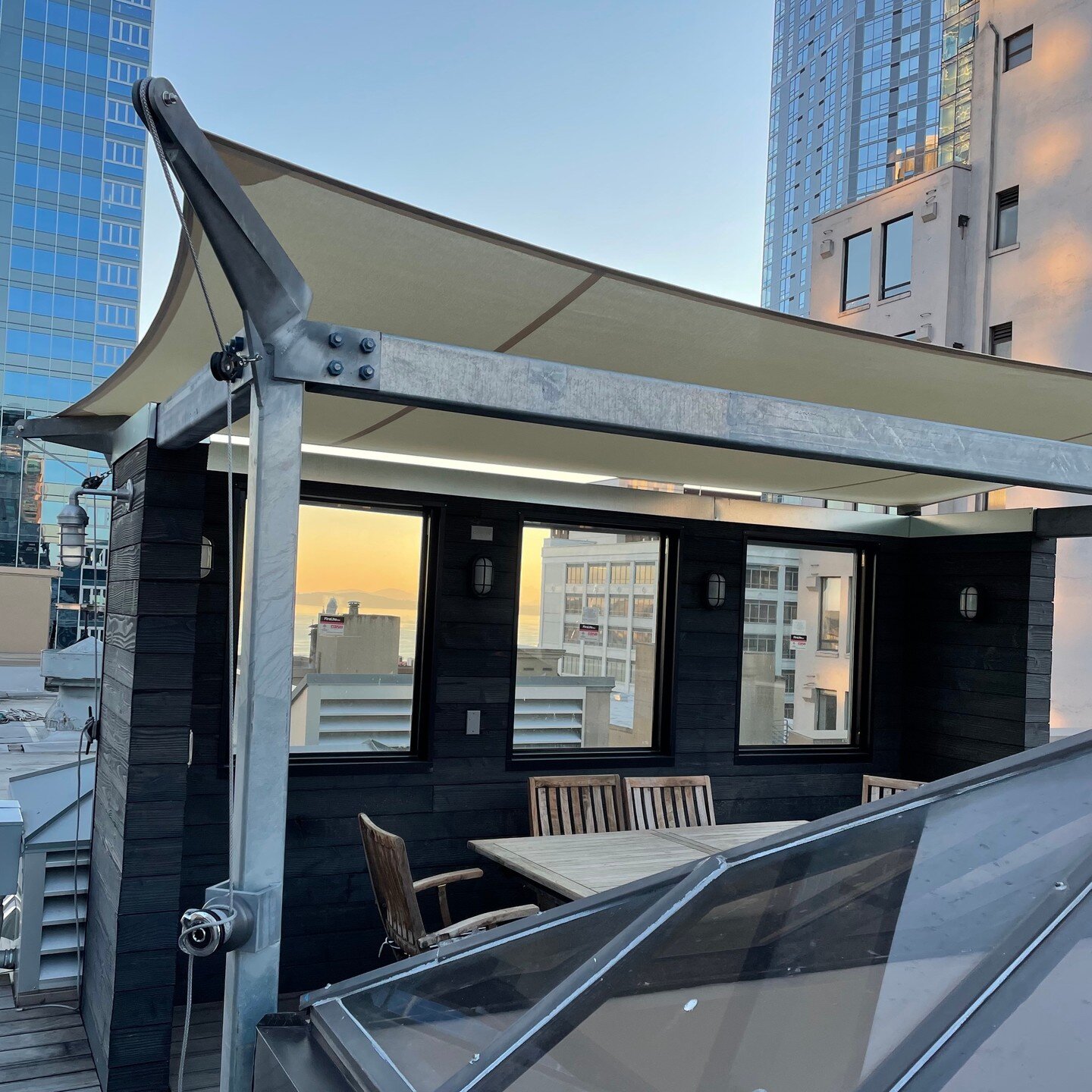 A new rooftop canopy in downtown Seattle and the icing on the cake for a larger 2 story condominium renovation, complete with new lift to this shady spot. It was designed to be easily demountable by it's user and it goes without saying that we were e