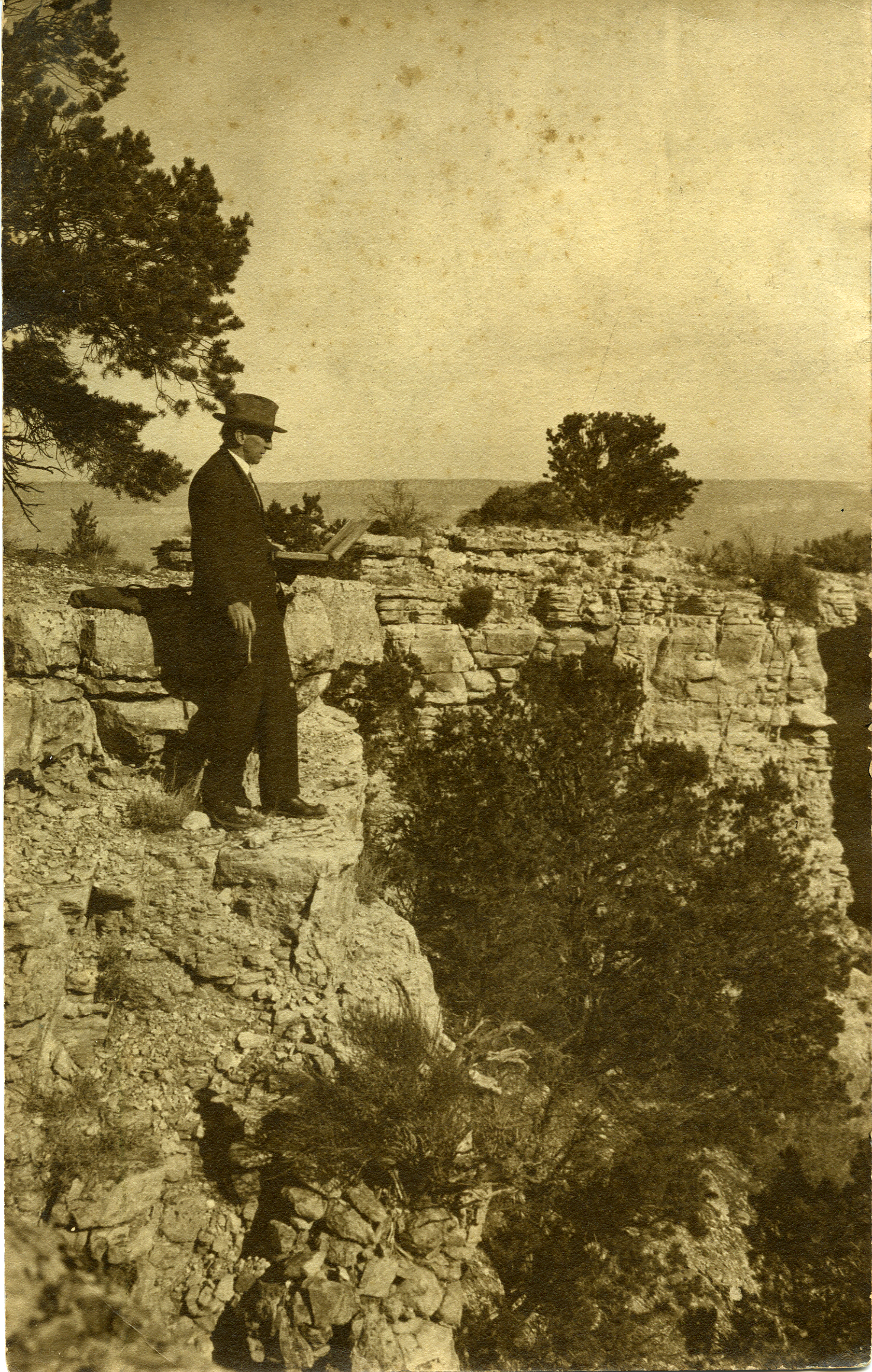   Elliott Daingerfield working at the rim of the Grand Canyon.  
