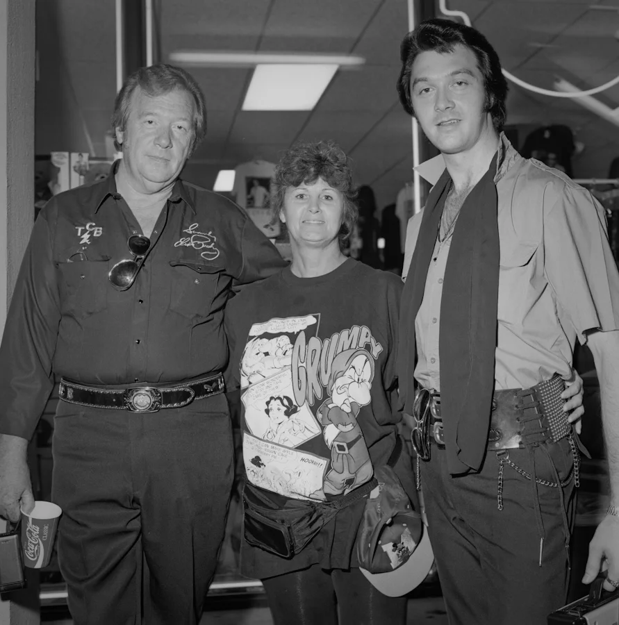Elvis Impersonators and fan.