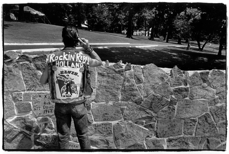 Dutch Elvis fan. "Rocking' Rebel" combs his pompadour. Elvis Death day, 1987