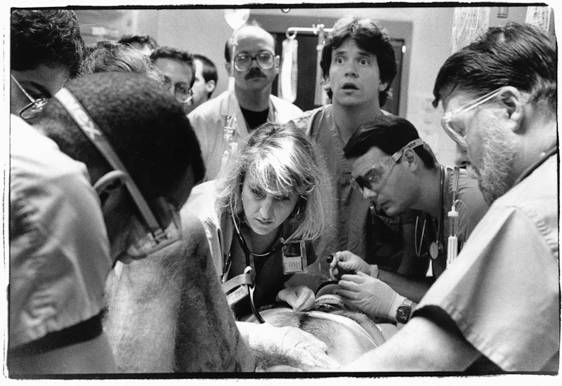 A team of young doctors attend to a hit and run accident victim.