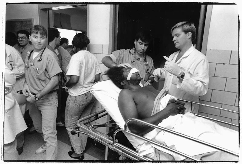 Dr. Mike Agapos and Paul Maurer attends to Charles Edwards,