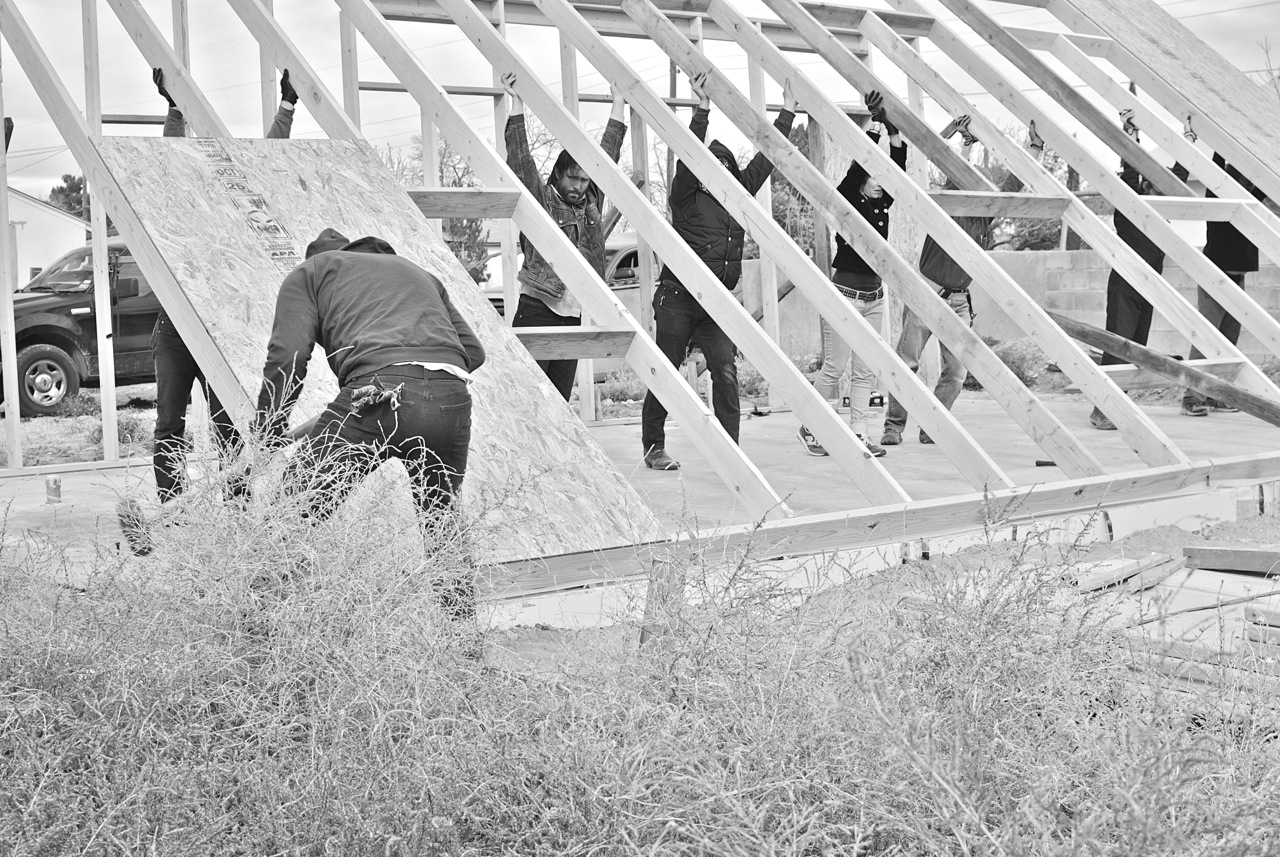 22 December 2014: Another angle on our high wall, photo by Martha (originally in color). 16-22 December 2014: Van drove into town while Lynn is away. Both the north (10ft) and south (16ft) walls are framed within the week.