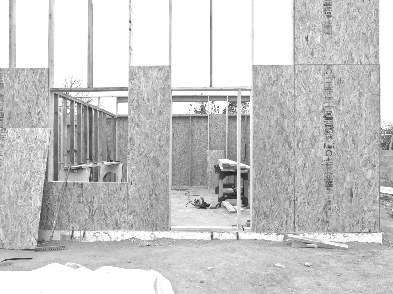 31 December 2014: Here is a section of the south wall. The square cutout on the left will be our picture window (double-paned single hung) and the human-sized rectangle on the right will be our front door.