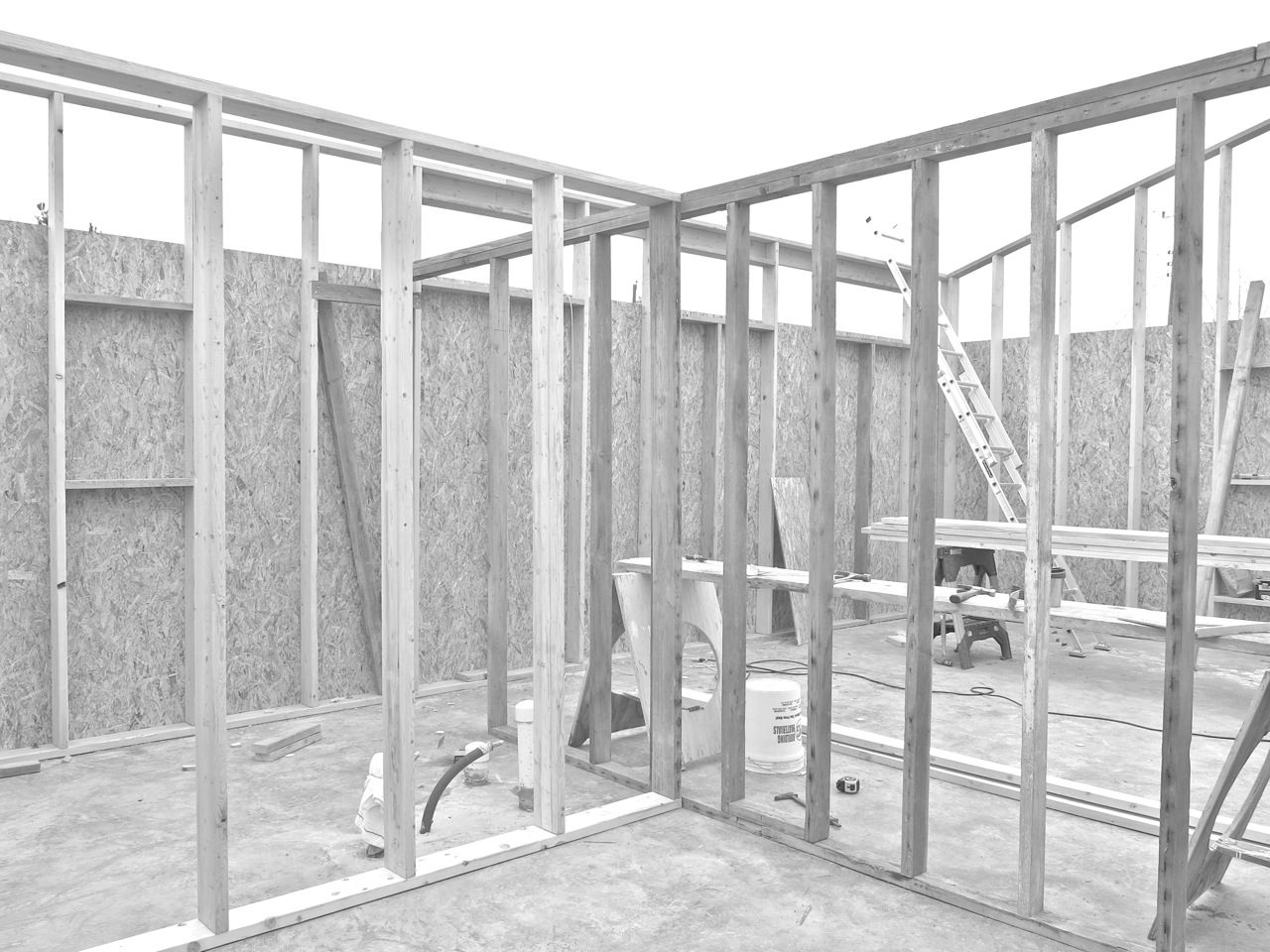 31 December 2014: It is the last day of the year and we've got weather in the teens. Here is a view of the framing from the far side of our bedroom. Looking at the axis, the left frames demarcate the bath from the bed, and the right partitions both the bath and bed from the open living space.