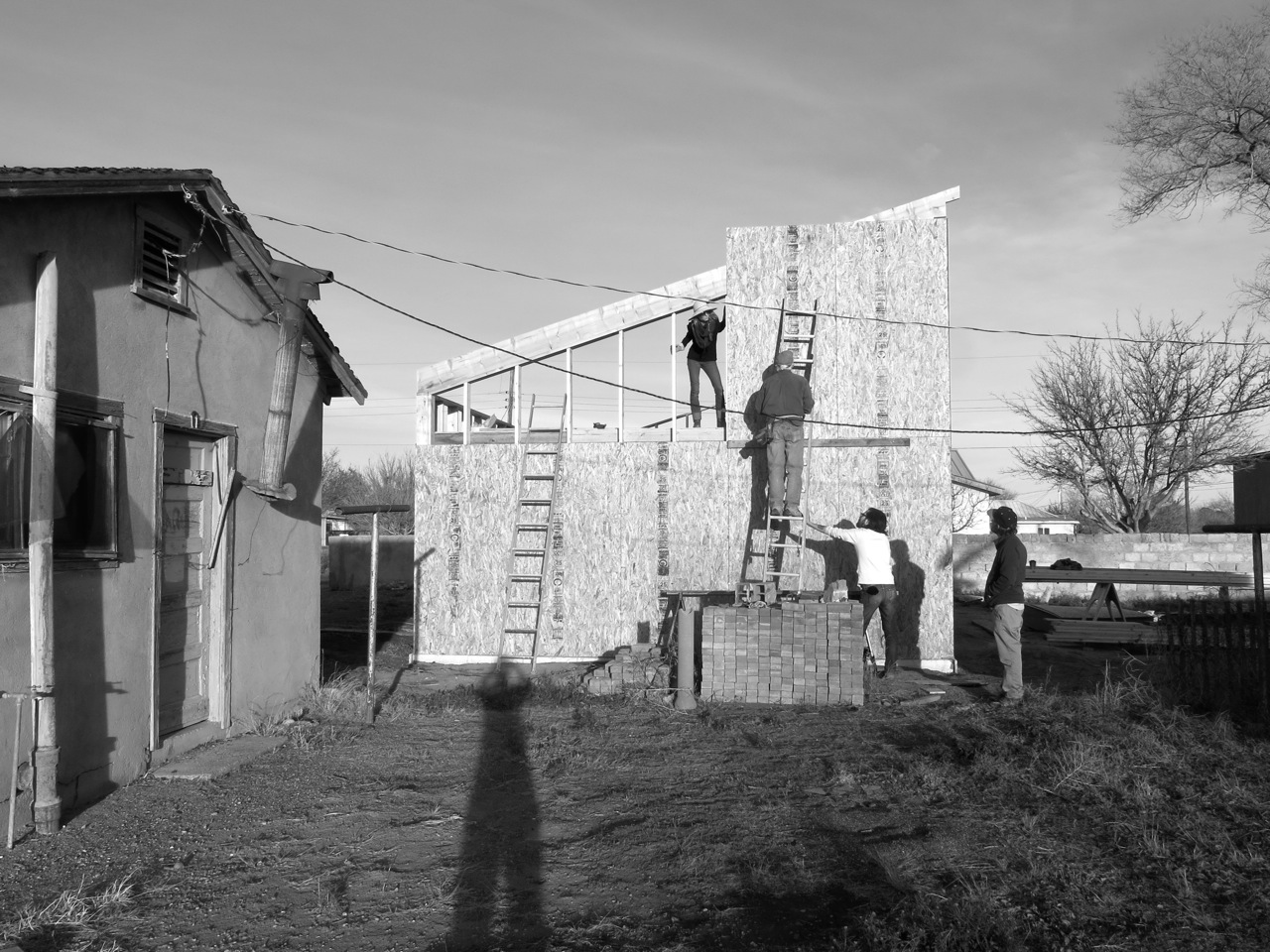6 January 2015: Lisa (leaning out from our loft), Van (on the ladder), Brandon (supporting the sinking ladder), Josh, and myself (elongated by the evening sun).