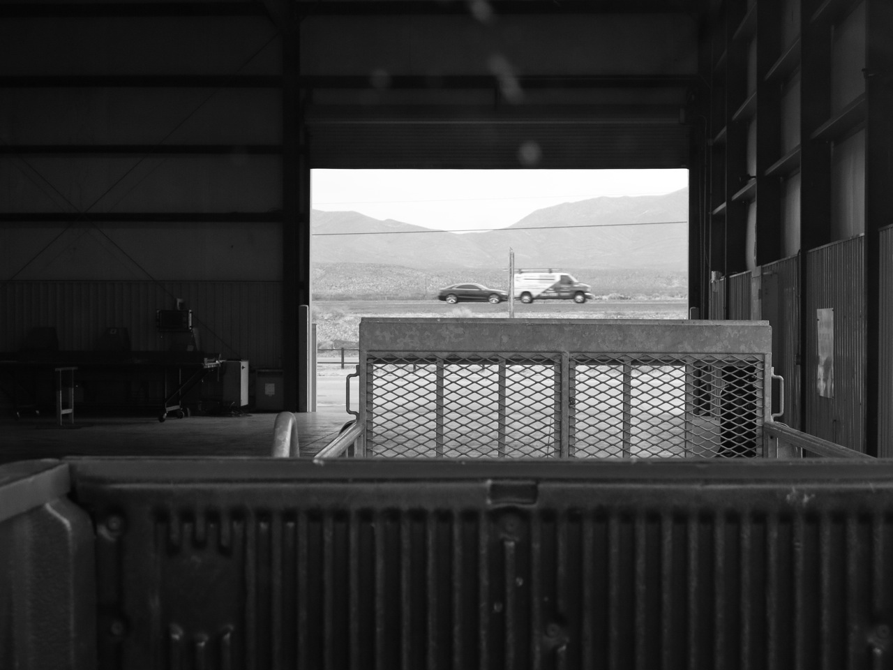 9 January 2015: Josh and I went to El Paso to pick up our Mueller U-Panel roofing material (26-gauge commercial grade steel, in white, for maximum reflectivity). This is a view from the loading station: truck-bed, trailer-hitch, and open road (2mi from New Mexico).