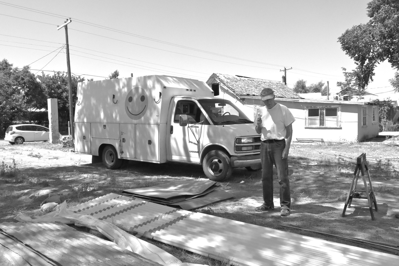 20 May 2015: Van eating coconut popsicle in front of Junie (our electrician's) truck.