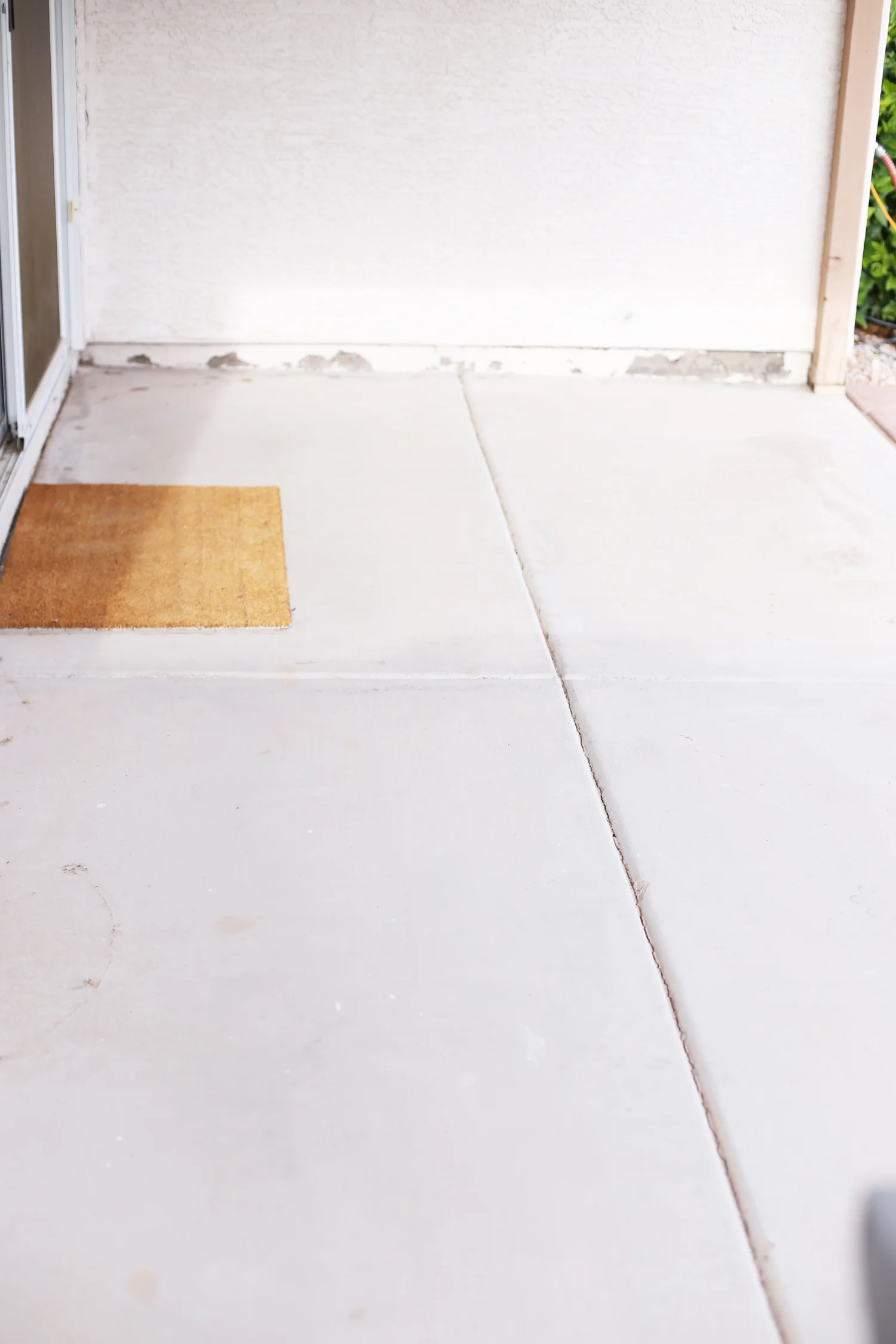 diamond pattern patio floor before photo