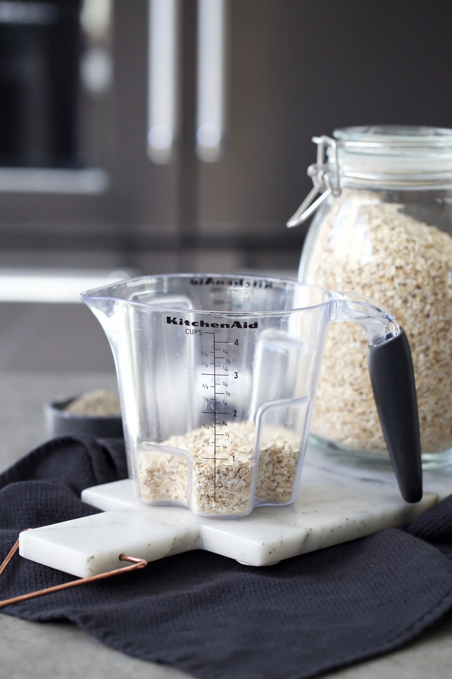 breakfast sundae bites measuring out oats