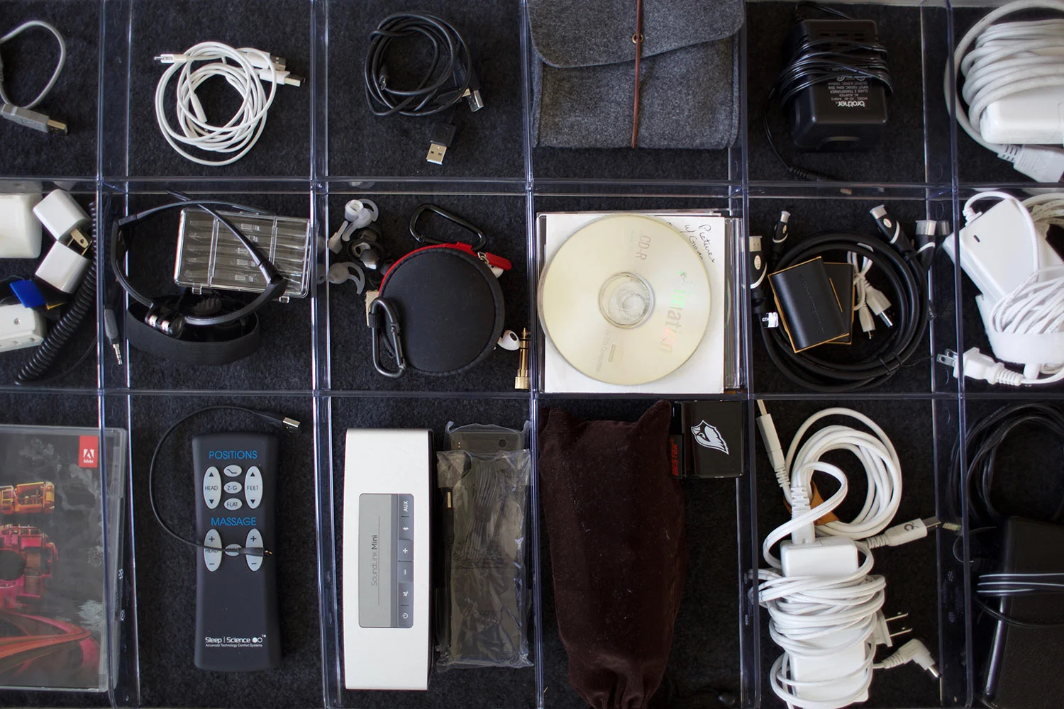organized cables and wires in a pull-out tray with dividers