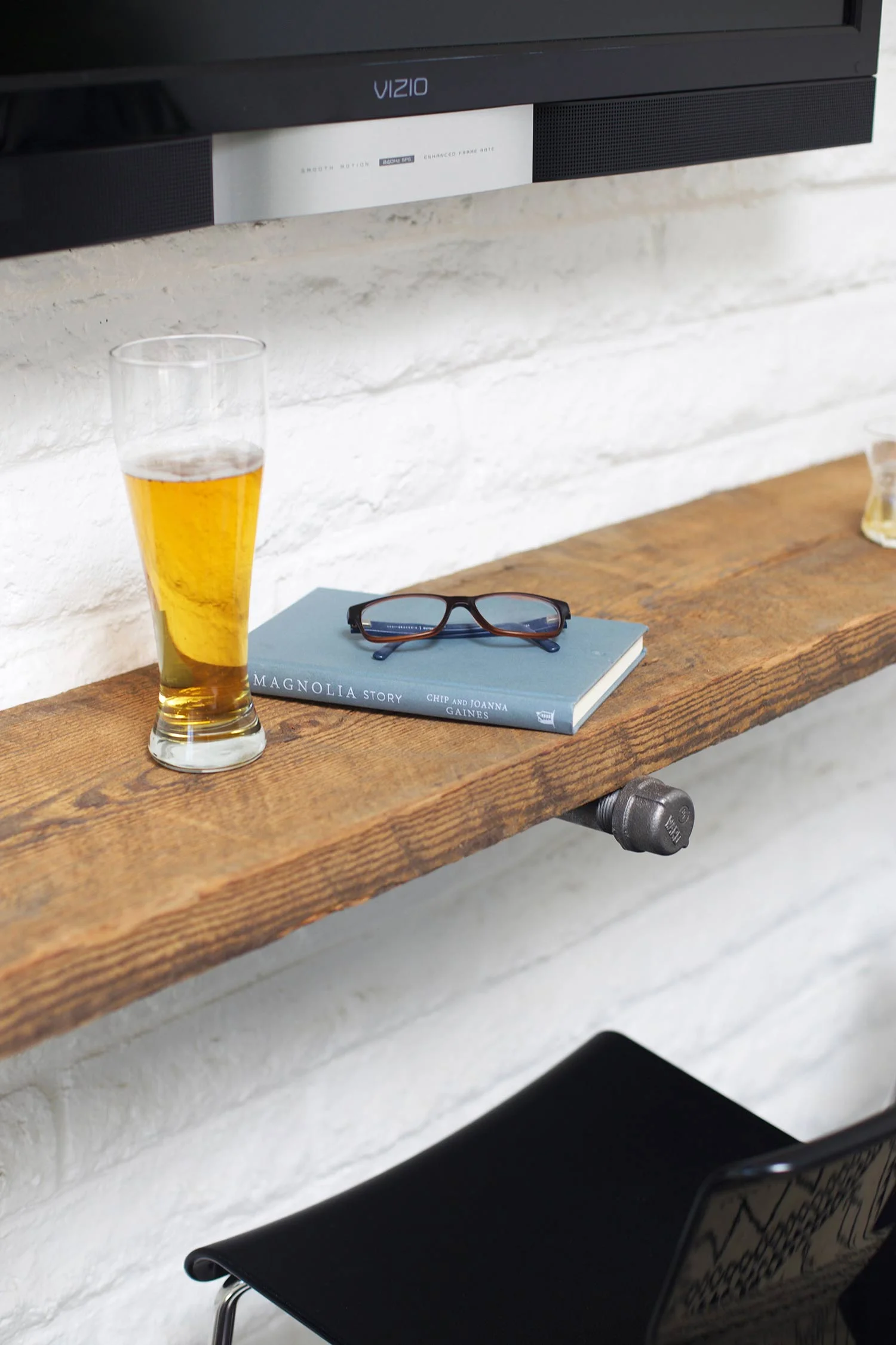 reclaimed wood shelf bar with drink and book