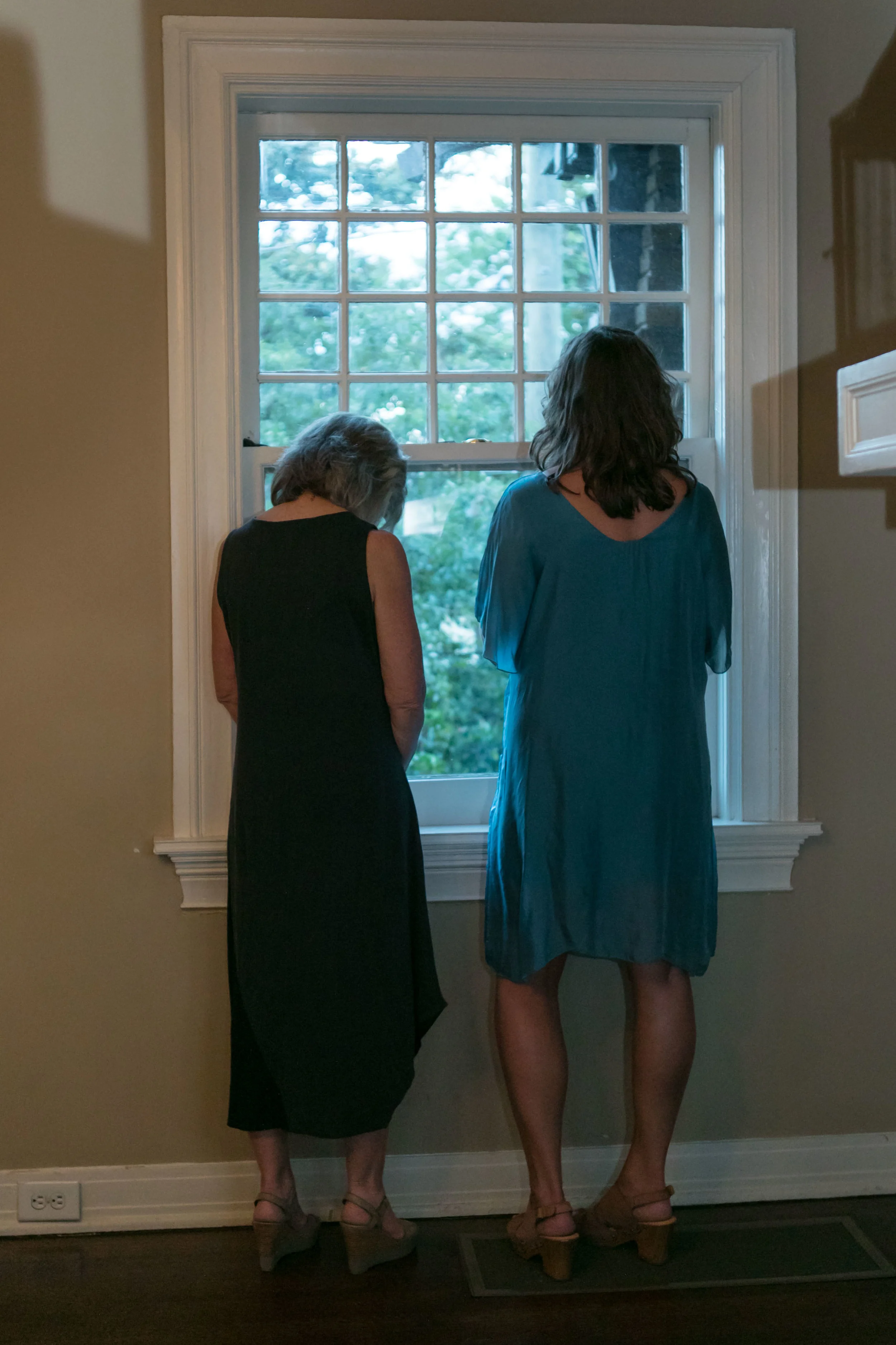Nancy and Gina pausing in prayer before the festivities Photo by Emily Kicklighter