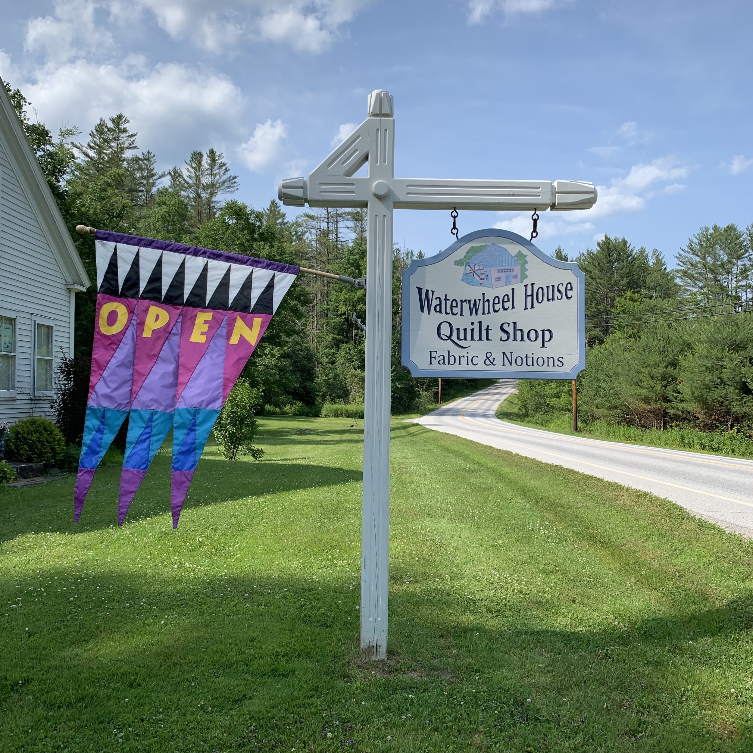 Sign in front of Waterwheel House Quilt Shop