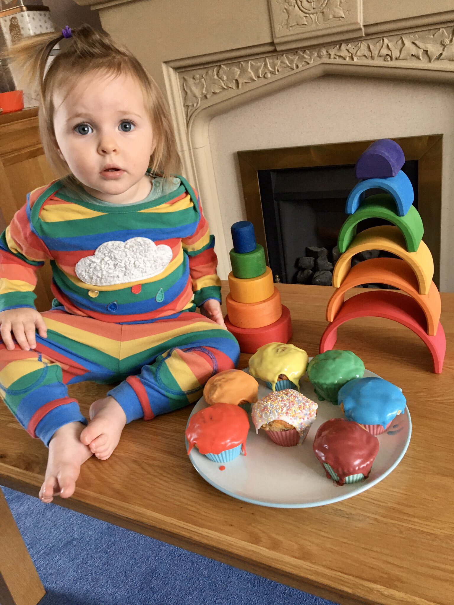 Holly Kenny's rainbow cupcakes and child