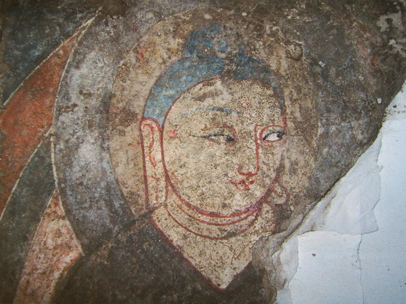 Mural depeciting Buddha also referred to as Mona Lisa of the Western Regions (a part, at the Xinjiang Archaeological Institute) Photo by. Y Kojima