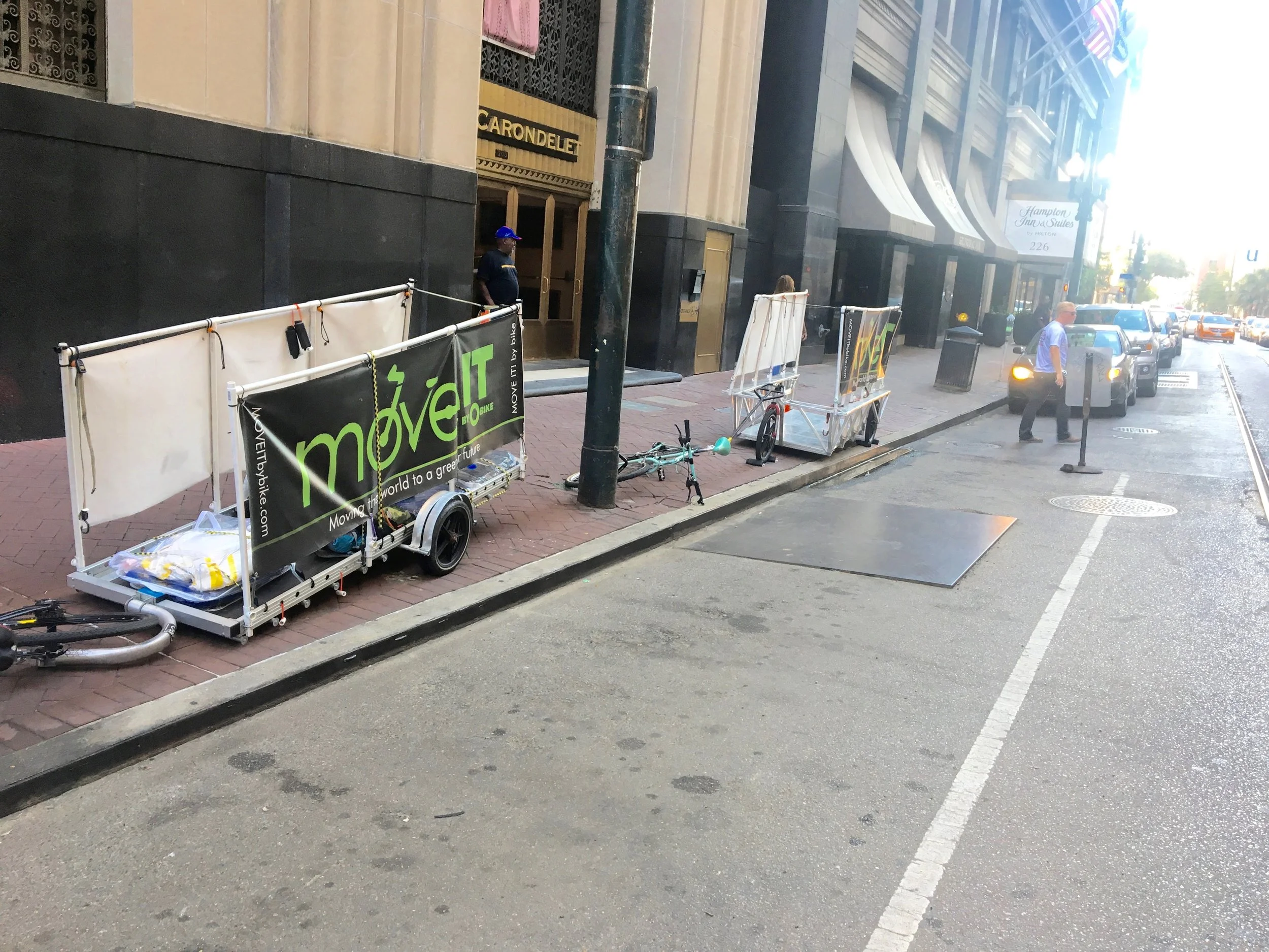 Out trailers ready to be loaded. People can walk past on the sidewalk and cars and trucks can still park beside us.