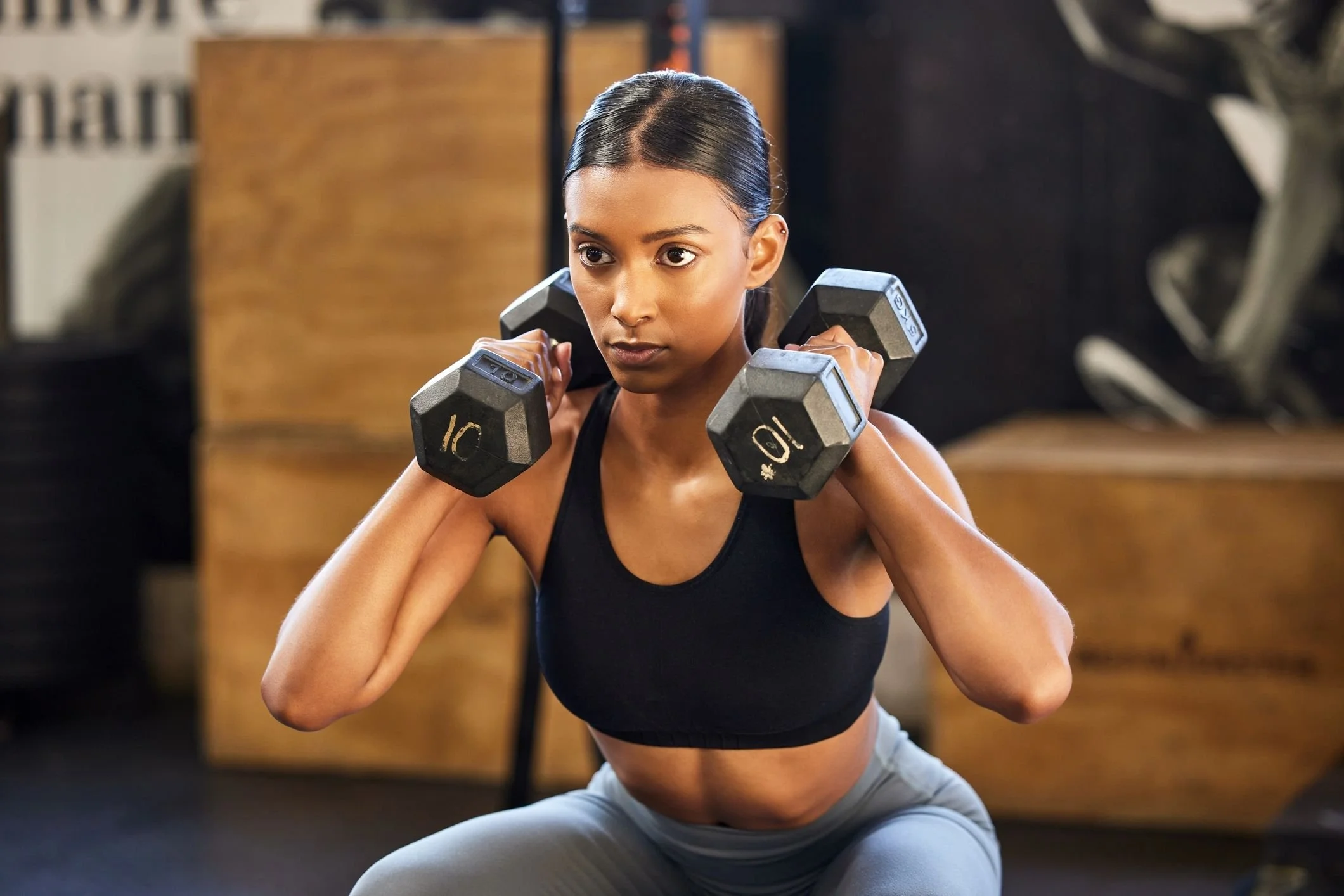 shot-of-a-young-woman-working-out-with-weights-in-a-royalty-free-image-1705679985.jpg