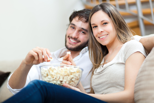 young couple eating popcorn.jpg