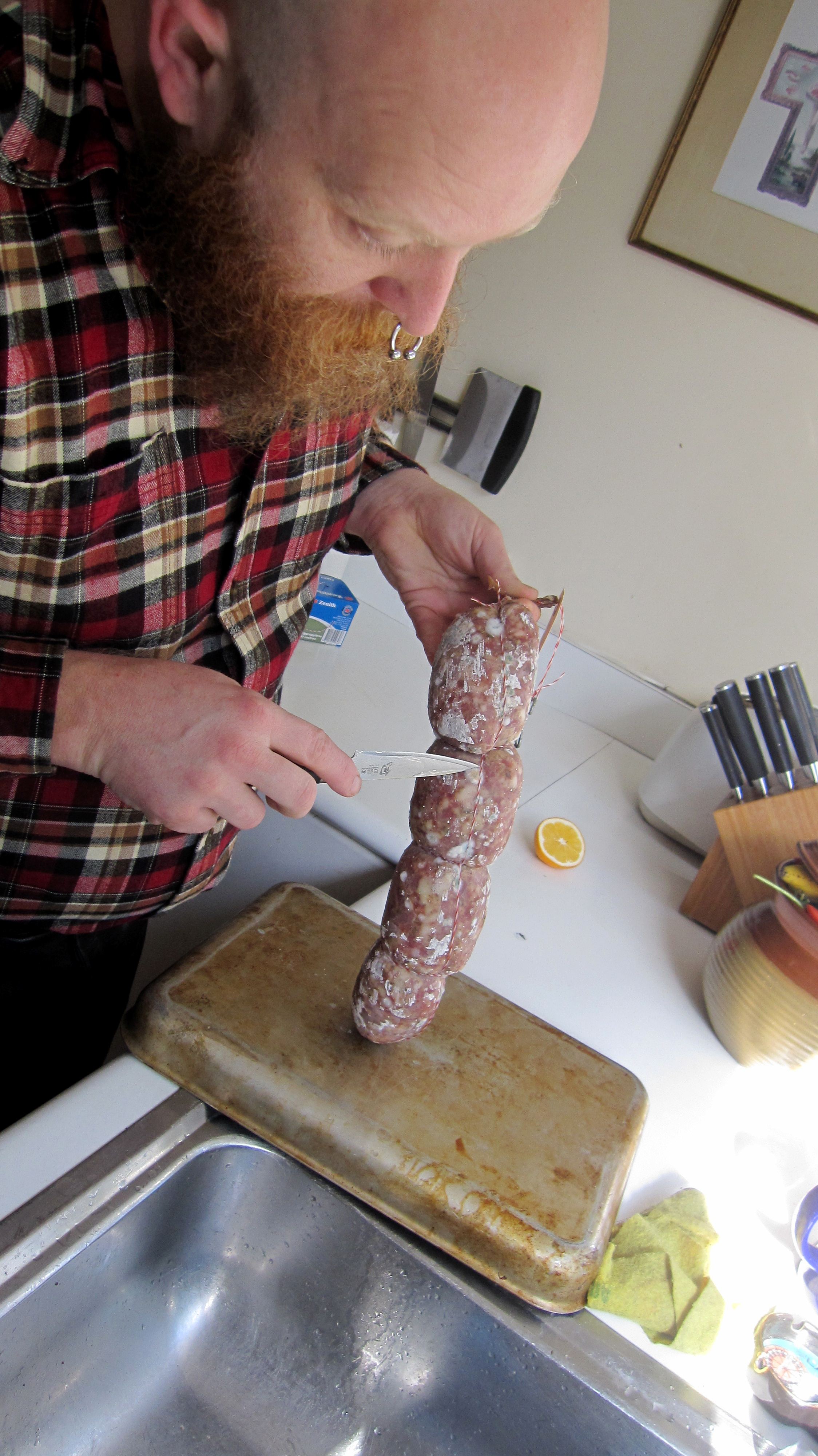 Scraping off the mould blooms with the back of a paring knife