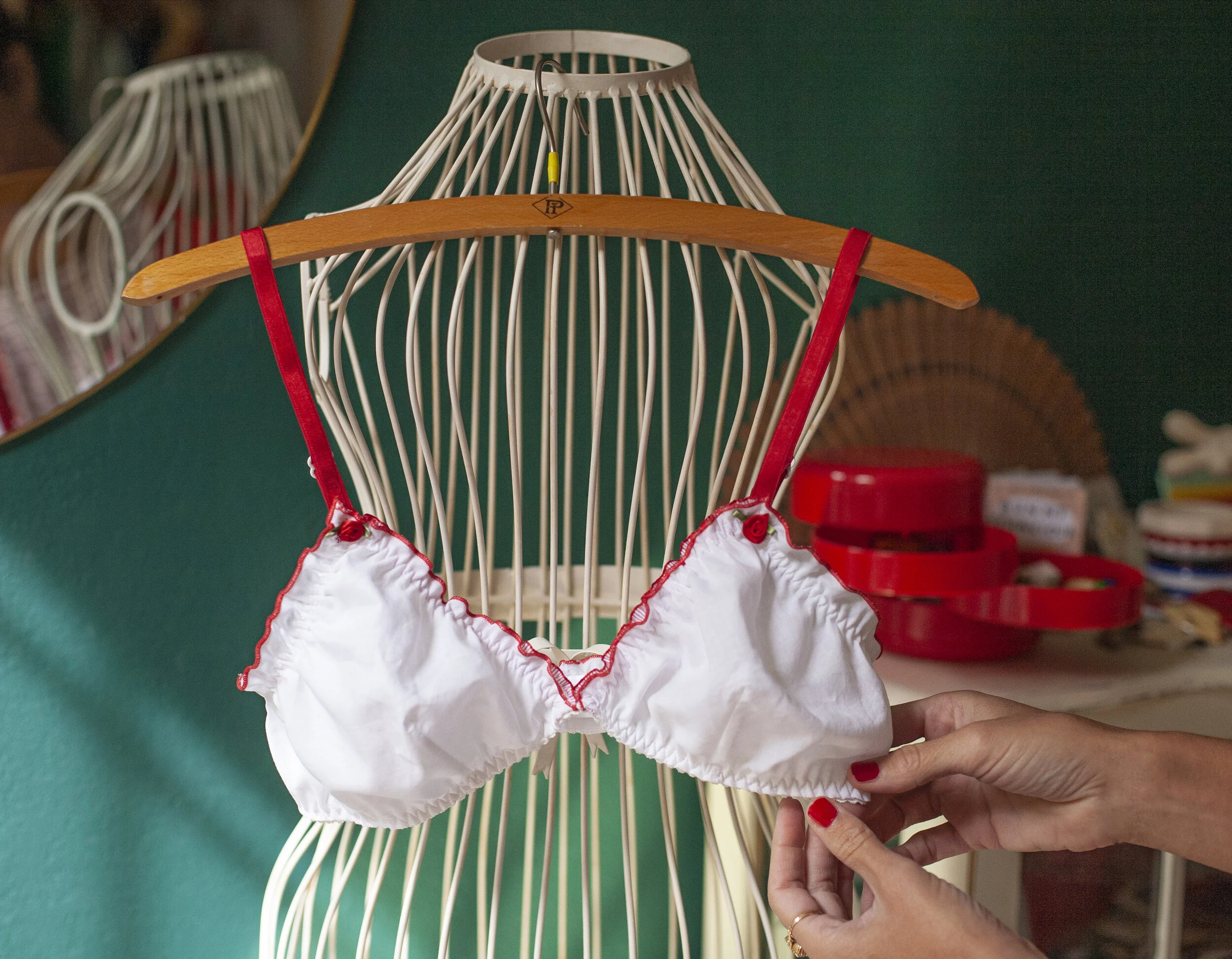 White cotton bra with red straps and red frilly edge