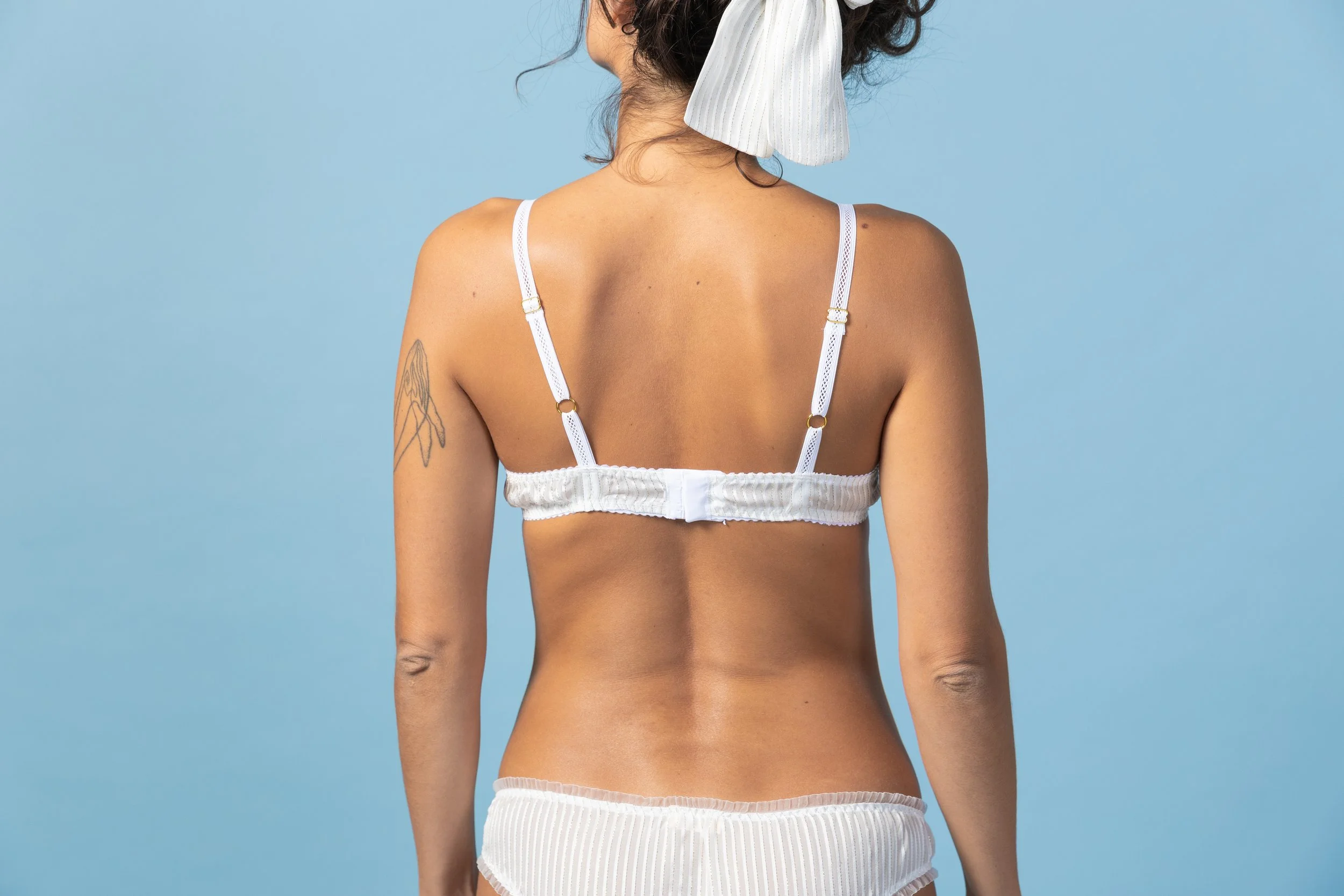 Back view of the Goldie luxury set in light ivory silk and gold thread ruffled bralette