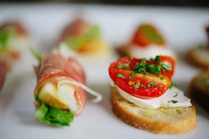 Proscuitto wrapped local apples, manchego, and greens Roasted cherry tomato, herb, and goat cheese bruschetta