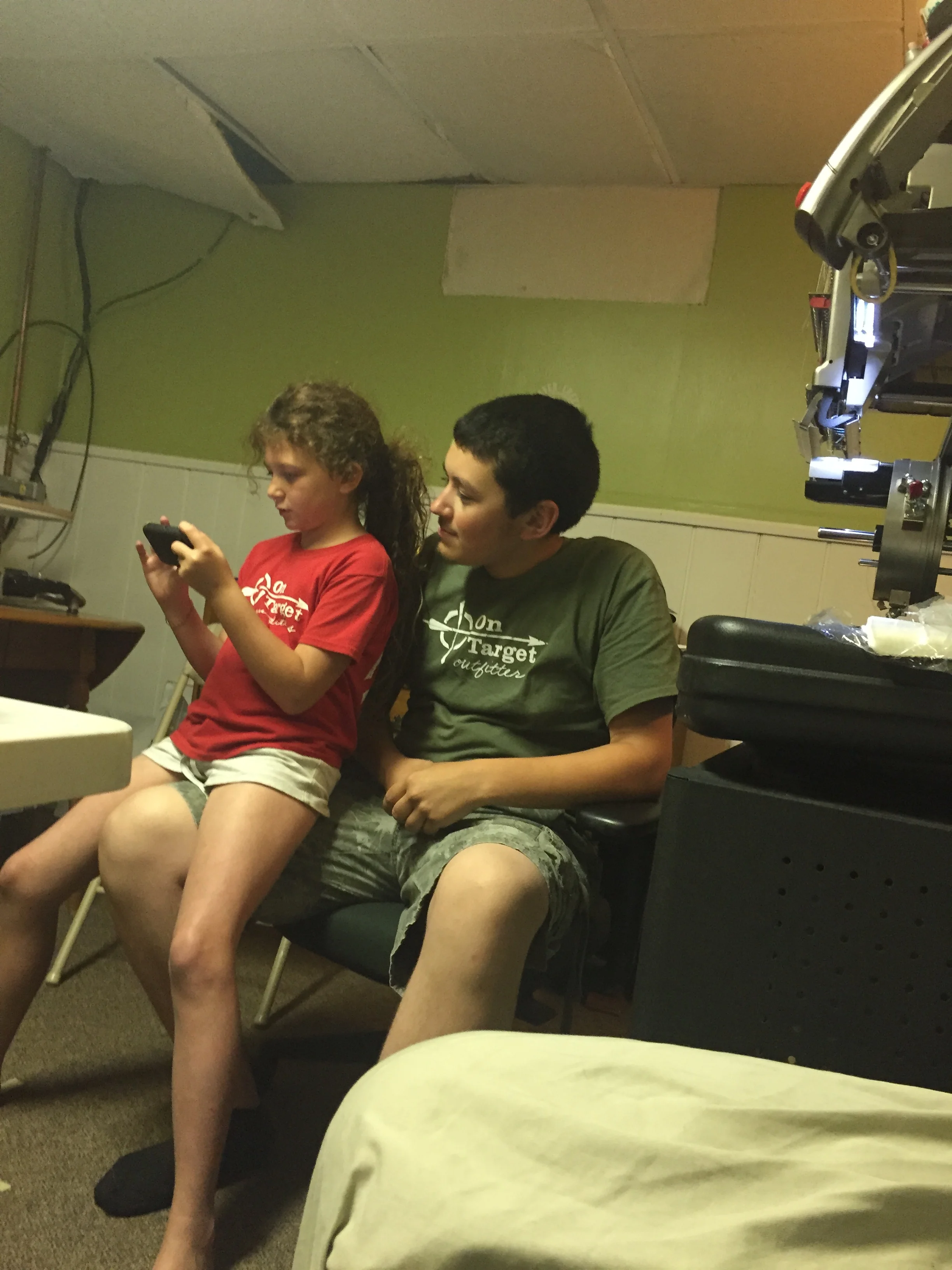 Clayton with his "sister" Eliza making On Target shirts at the Isgro's house!