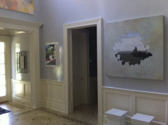 Paintings by Karen Seapker (left), Man in Grey Flannel ; and Shane McAdams, Chenle