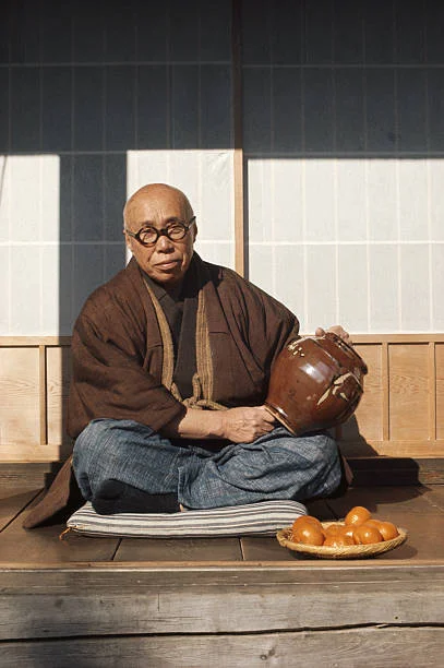 Shoji Hamada outside his Mashiko pottery studio in 1974