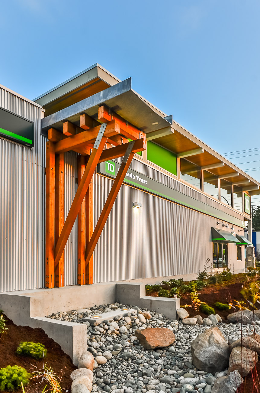Feature galvanized steel rainwater scupper with backlit waterfall into bioswale as animated feature to passersby.