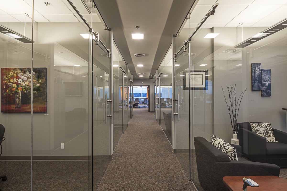 Contemporary glazed corridors bringing in natural daylight and view out.